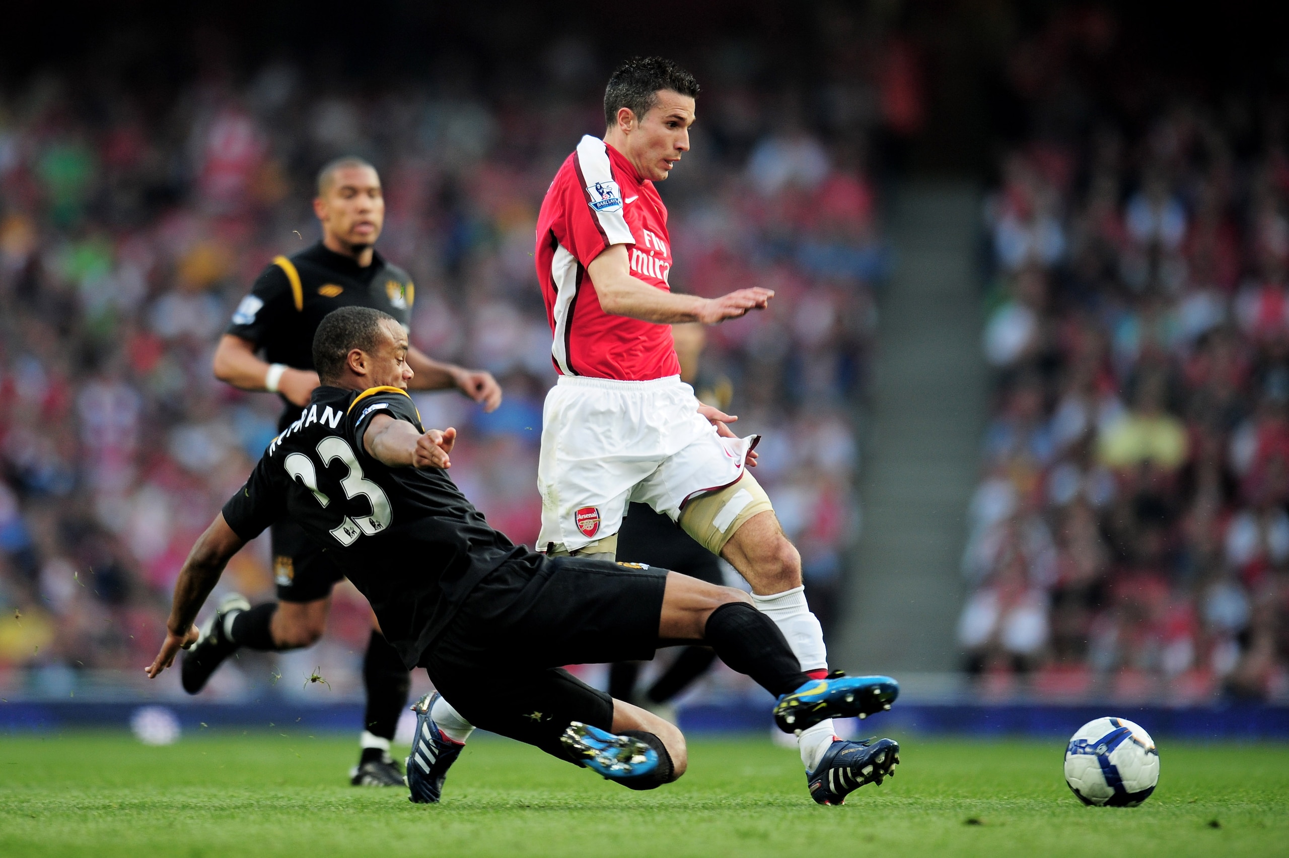 LONDON, ENGLAND - APRIL 24:  Robin Van Persie of Arsenal is tackled by Vincent Kompany of Manchester City during the Barclays Premier League match between Arsenal and Manchester City at the Emirates Stadium on April 24, 2010 in London, England.  (Photo by