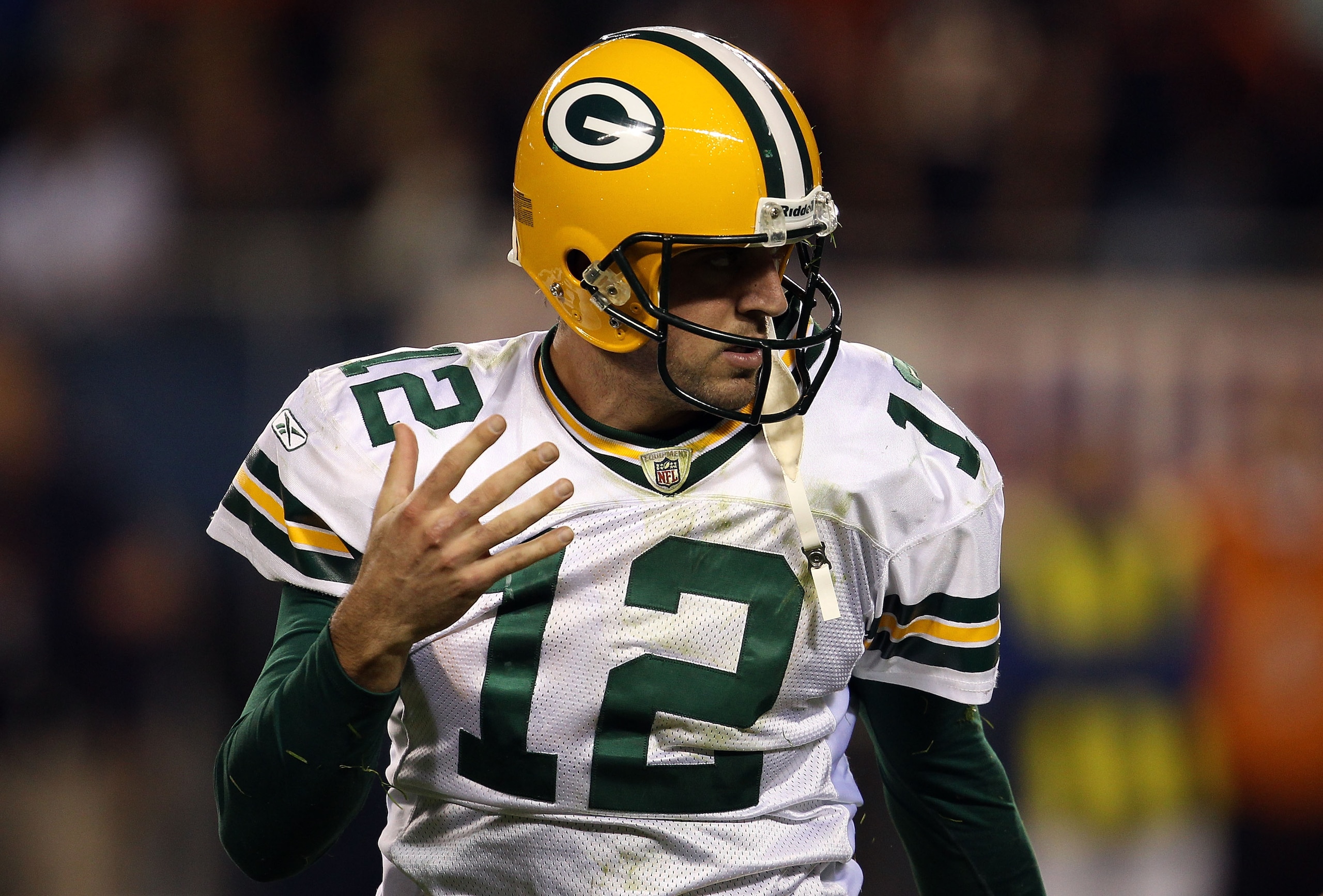 CHICAGO - SEPTEMBER 27:  Quarterback Aaron Rodgers #12 of the Green Bay Packers reacts against the Chicago Bears at Soldier Field on September 27, 2010 in Chicago, Illinois.  (Photo by Jonathan Daniel/Getty Images)