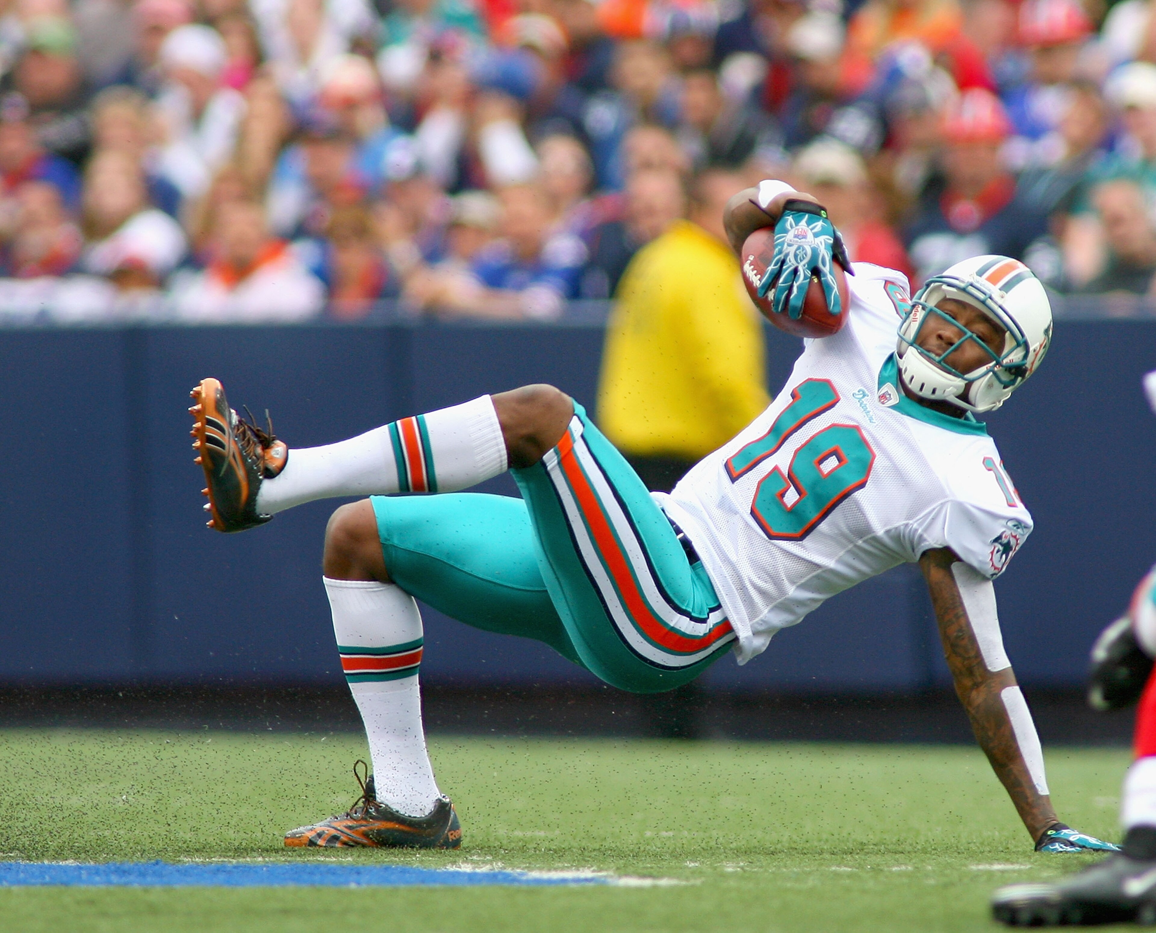 ORCHARD PARK, NY - SEPTEMBER 12: Brandon Marshall #19 of the Miami Dolphins keeps his footing against the Buffalo Bills during the NFL season opener at Ralph Wilson Stadium on September 12, 2010 in Orchard Park, New York. (Photo by Rick Stewart/Getty Im ORCHARD PARK, NY - SEPTEMBER 12: Brandon Marshall #19 of the Miami Dolphins keeps his footing against the Buffalo Bills during the NFL season opener at Ralph Wilson Stadium on September 12, 2010 in Orchard Park, New York. (Photo by Rick Stewart/Getty Im