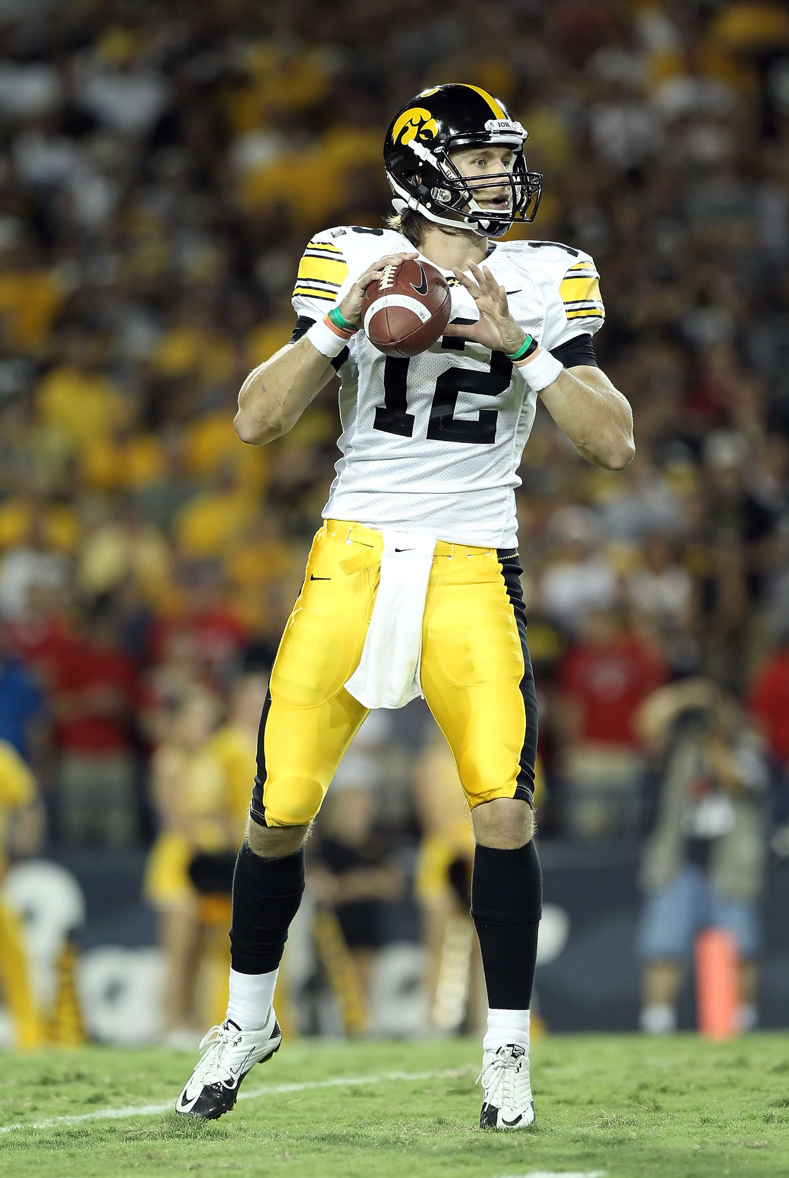 TUCSON, AZ - SEPTEMBER 18:  Quarterback Ricky Stanzi #12 of the Iowa Hawkeyes in action during the college football game against the Arizona Wildcats at Arizona Stadium on September 18, 2010 in Tucson, Arizona.  The Wildcats defeated the Hawkeyes 34-27.