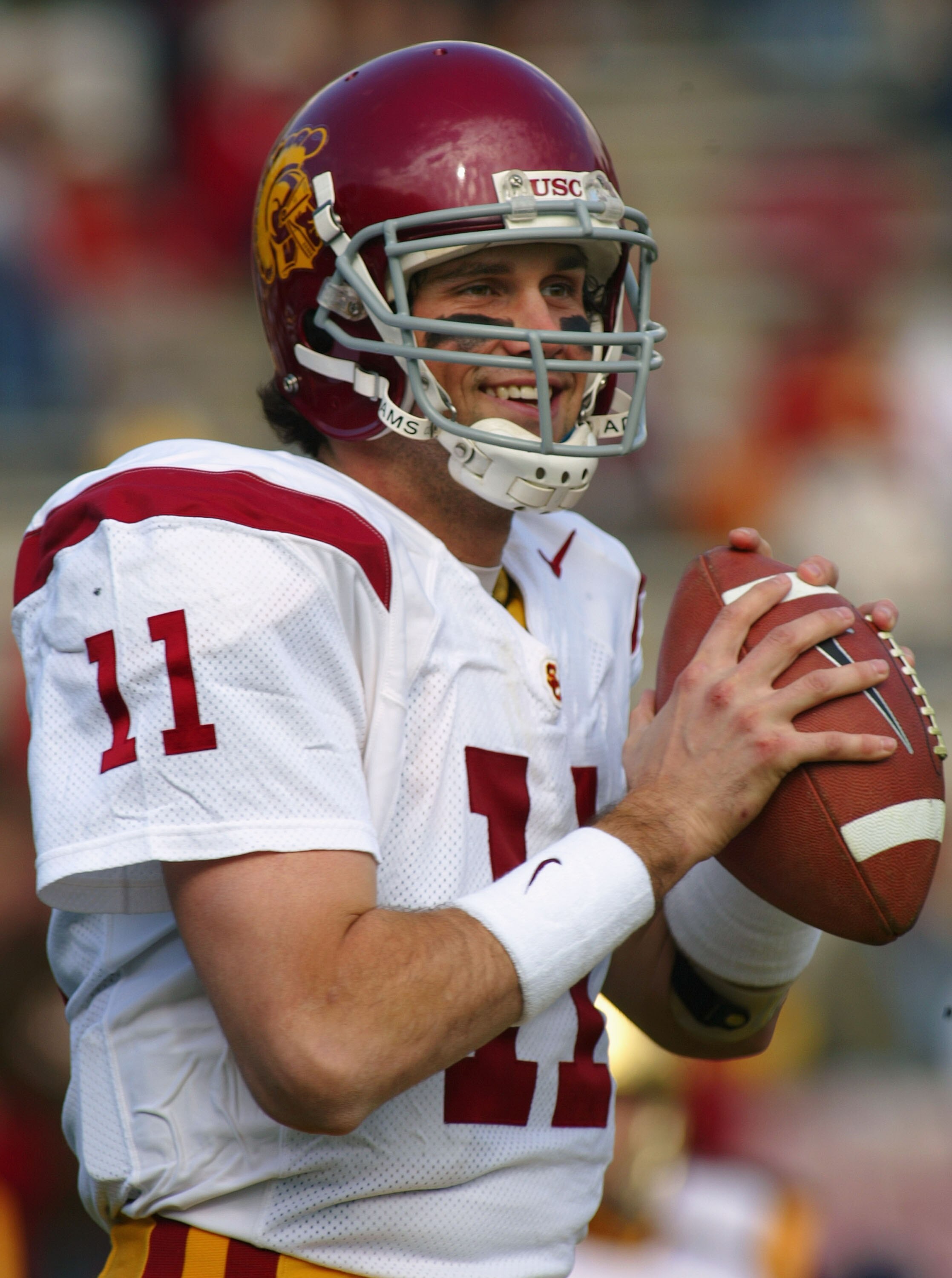 PASADENA, CA - DECEMBER 4:  Quarterback Matt Leinart #11 of the USC Trojans warms up before the game against the UCLA Bruins on December 4, 2004 at the Rose Bowl in Pasadena, California.  The Trojans defeated the Bruins 29-24.  (Photo by Christian Peterse