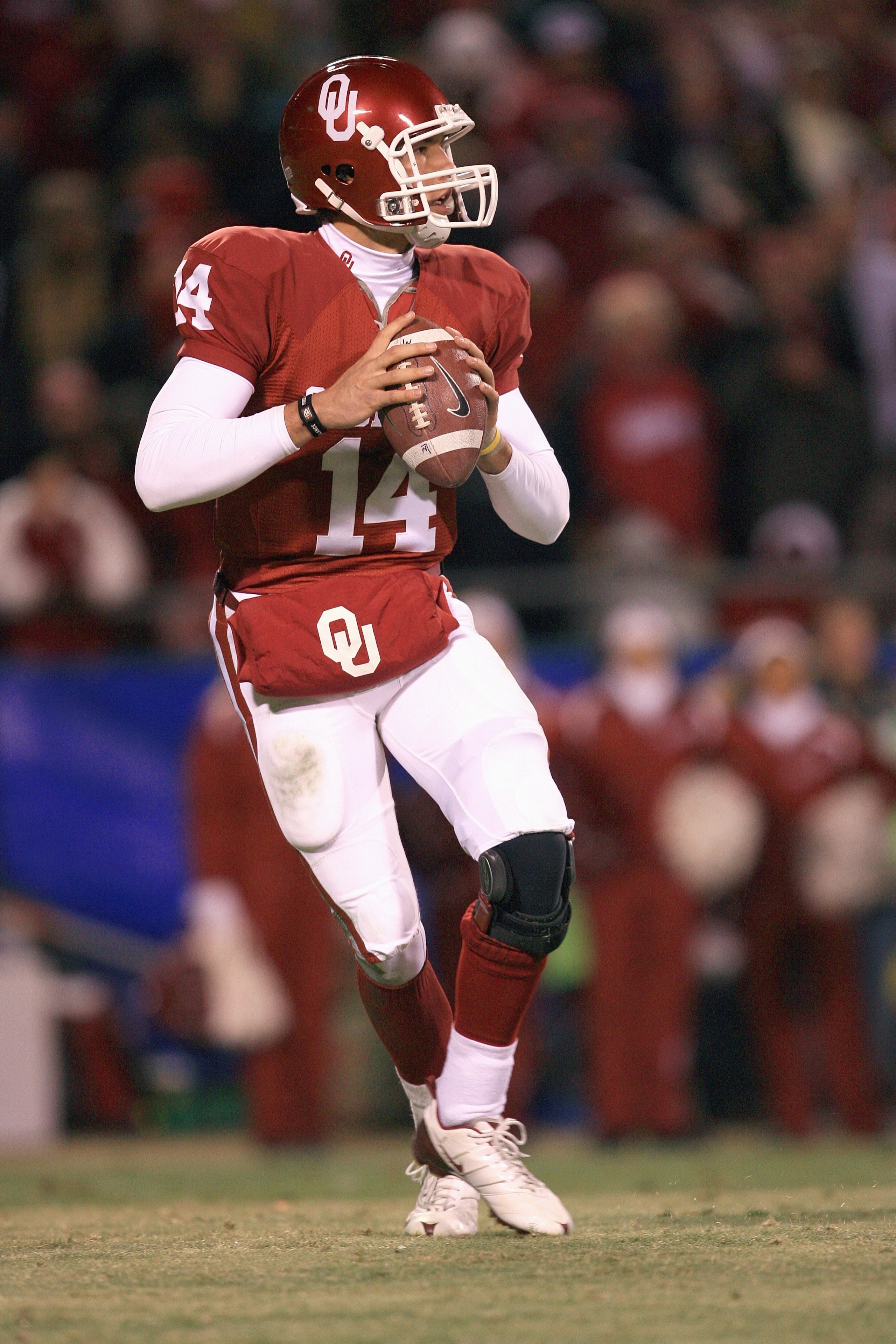 KANSAS CITY, MO - DECEMBER 06:  Quarterback Sam Bradford #14 of the Oklahoma Sooners drops back to pass the ball during the Big 12 Championship game against the Missouri Tigers on December 6, 2008 at Arrowhead Stadium in Kansas City, Missouri. (Photo by J