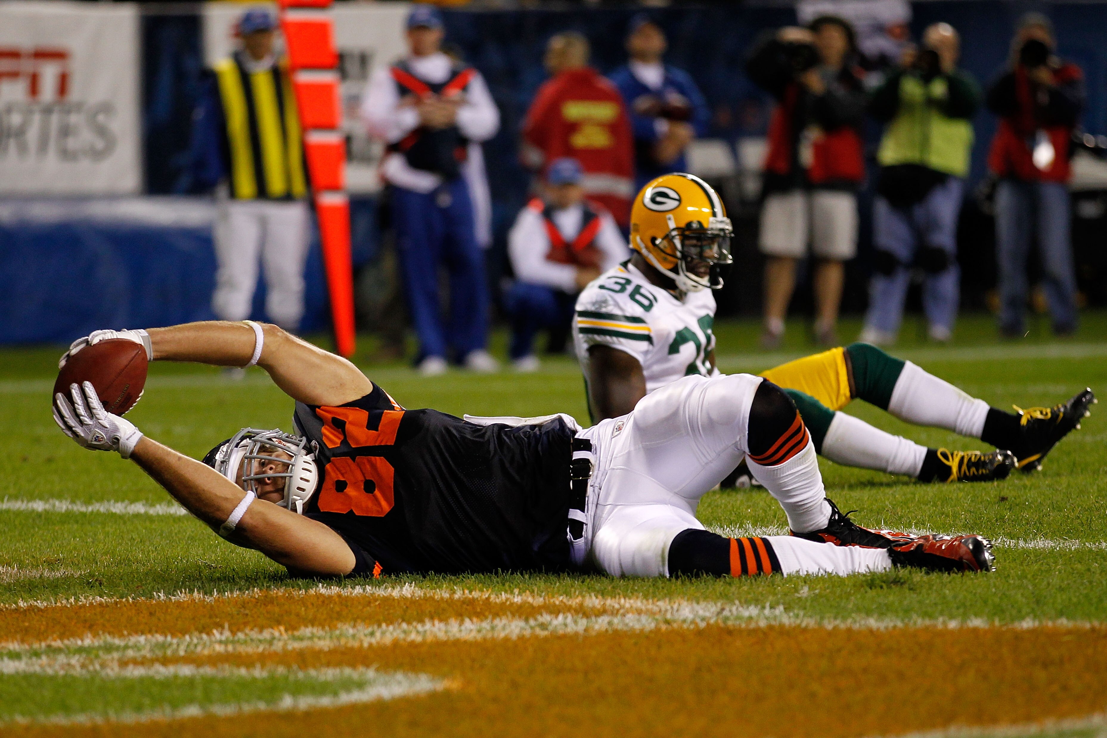 CHICAGO - SEPTEMBER 27: Greg Olsen #82 of the Chicago Bears catches a 9-yard touchdown reception in the second quarter against Nick Collins #36 of the Green Bay Packers at Soldier Field on September 27, 2010 in Chicago, Illinois. (Photo by Jonathan Dani CHICAGO - SEPTEMBER 27: Greg Olsen #82 of the Chicago Bears catches a 9-yard touchdown reception in the second quarter against Nick Collins #36 of the Green Bay Packers at Soldier Field on September 27, 2010 in Chicago, Illinois. (Photo by Jonathan Dani