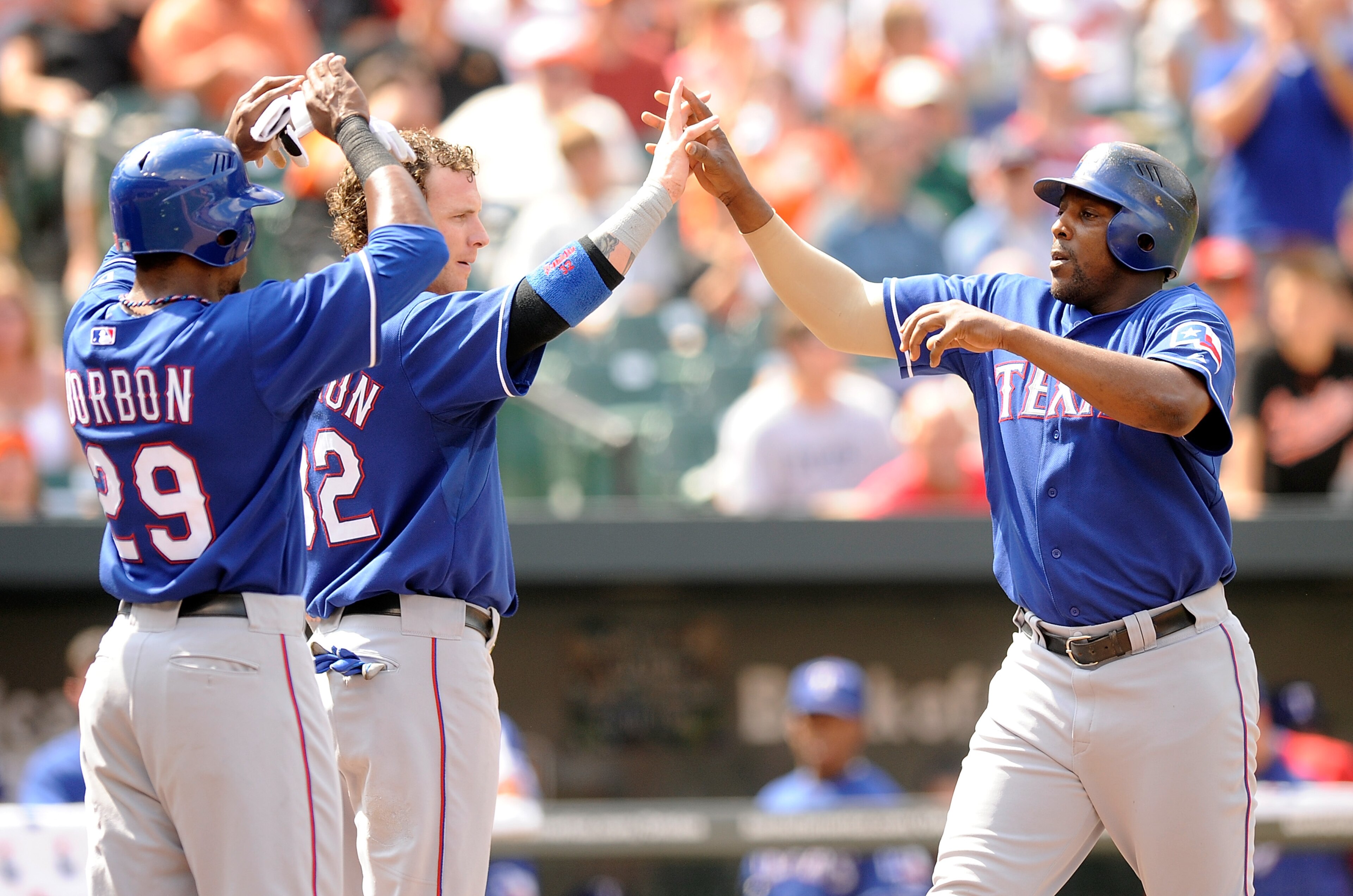 BALTIMORE - AUGUST 22:  Vladimir Guerrero #27 of the Texas Rangers celebrates with Josh Hamilton #32 and Julio Borbon #29 after hitting a home run in the fifth inning against the Baltimore Orioles at Camden Yards on August 22, 2010 in Baltimore, Maryland.