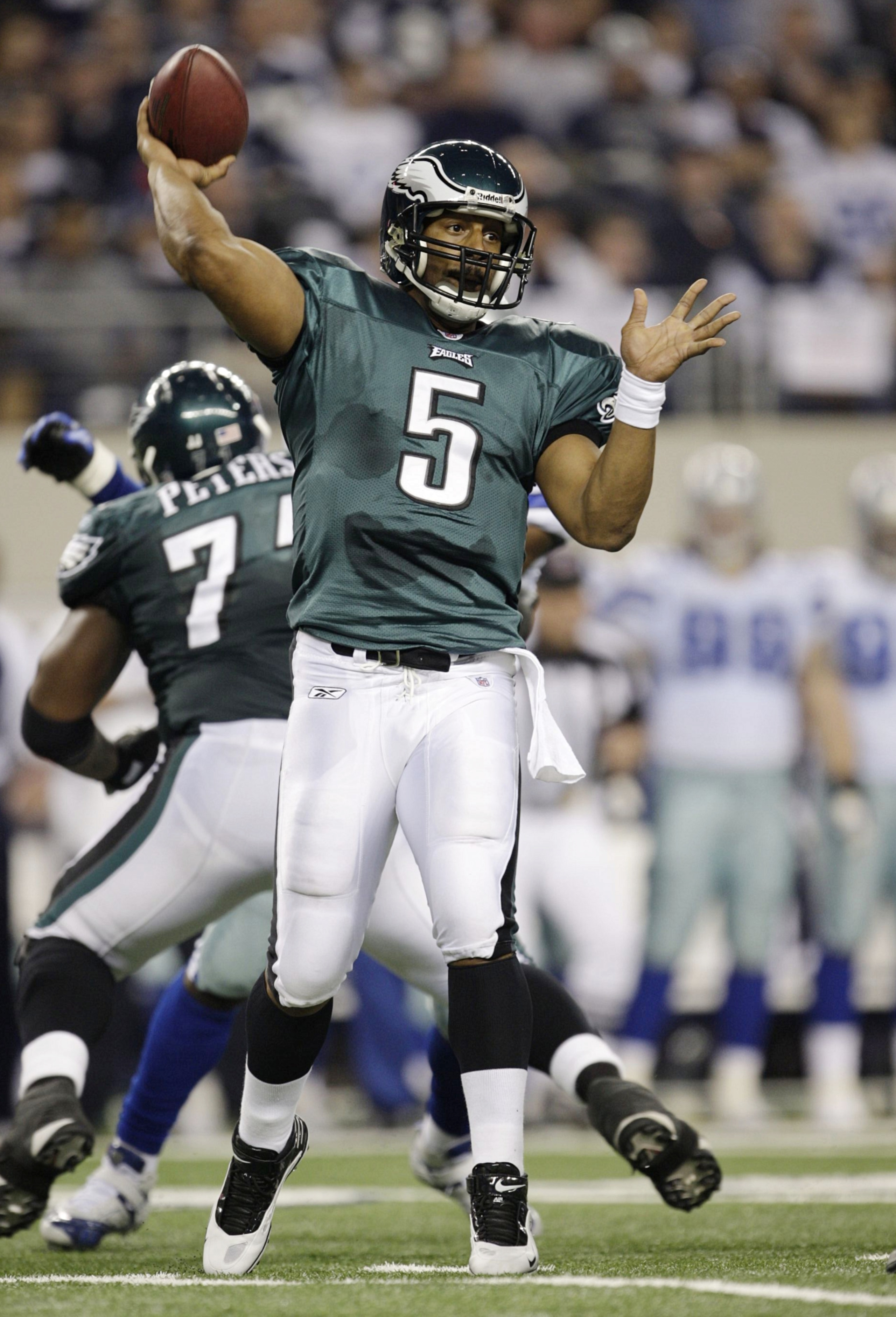 ARLINGTON, TX - JANUARY 9:  Quarterback Donovan McNabb #5 of the Philadelphia Eagles throws the ball in the second half against the Dallas Cowboys during the 2010 NFC wild-card playoff game at Cowboys Stadium on January 9, 2010 in Arlington, Texas. (Photo