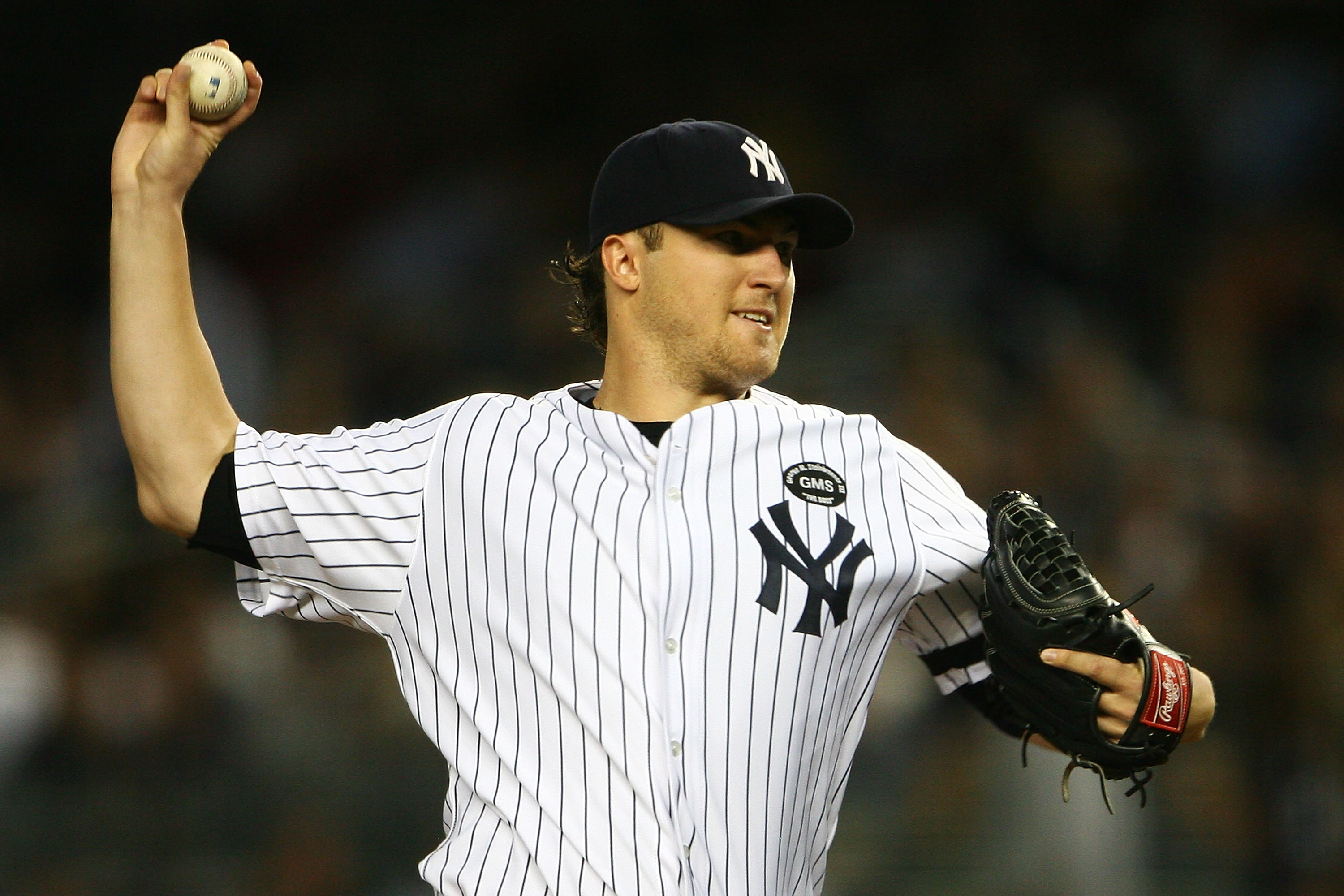 NEW YORK - SEPTEMBER 21:  Phil Hughes #65 of the New York Yankees pitches against the Tampa Bay Rays on September 21, 2010 at Yankee Stadium in the Bronx borough of New York City.  (Photo by Andrew Burton/Getty Images)