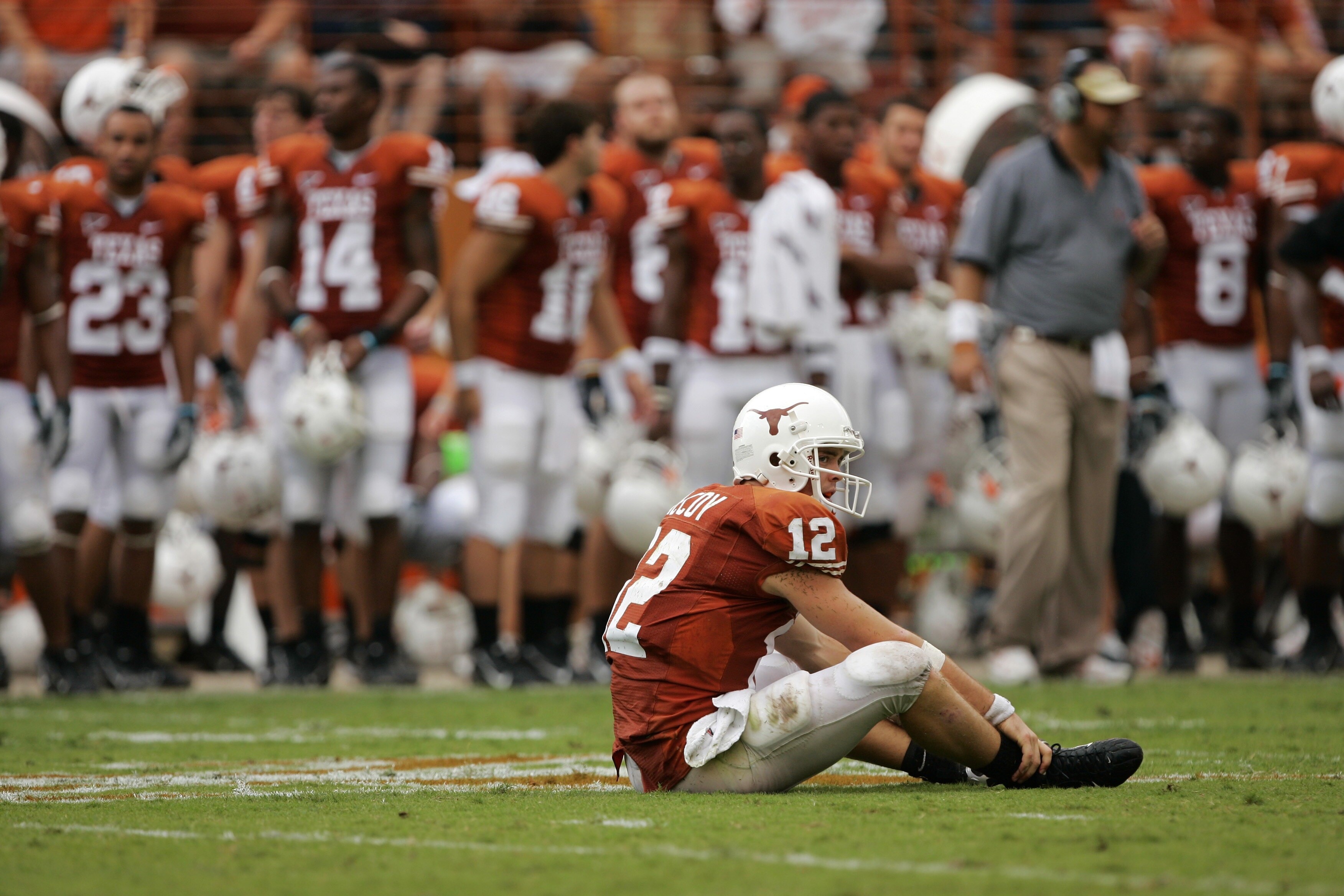 AUSTIN, TX - SEPTEMBER 29:  Quarterback Colt McCoy #12 of the Texas Longhorns sits in the middle of the field after throwing an incomplete pass against the Kansas State Wildcats late in the fourth quarter on September 29, 2007 at Darrell K Royal-Texas Mem