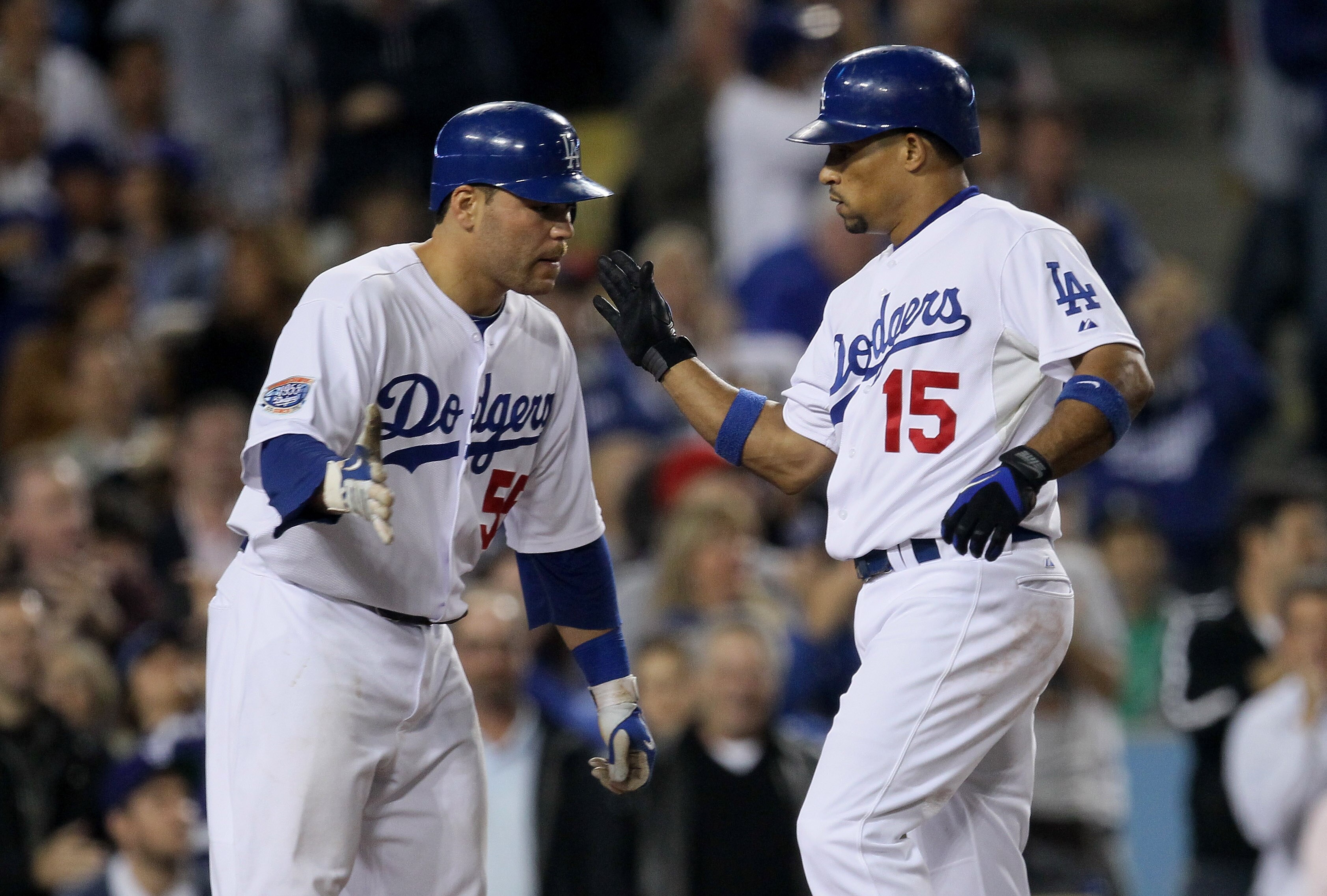 LOS ANGELES, CA - JULY 08:  Rafael Furcal #15 and Russell Martin #55 of the Los Angeles Dodgers celebrate at home after both score on Furcal's two run home run against the Chicago Cubs in the seventh inning on July 8, 2010 at Dodger Stadium in Los Angeles