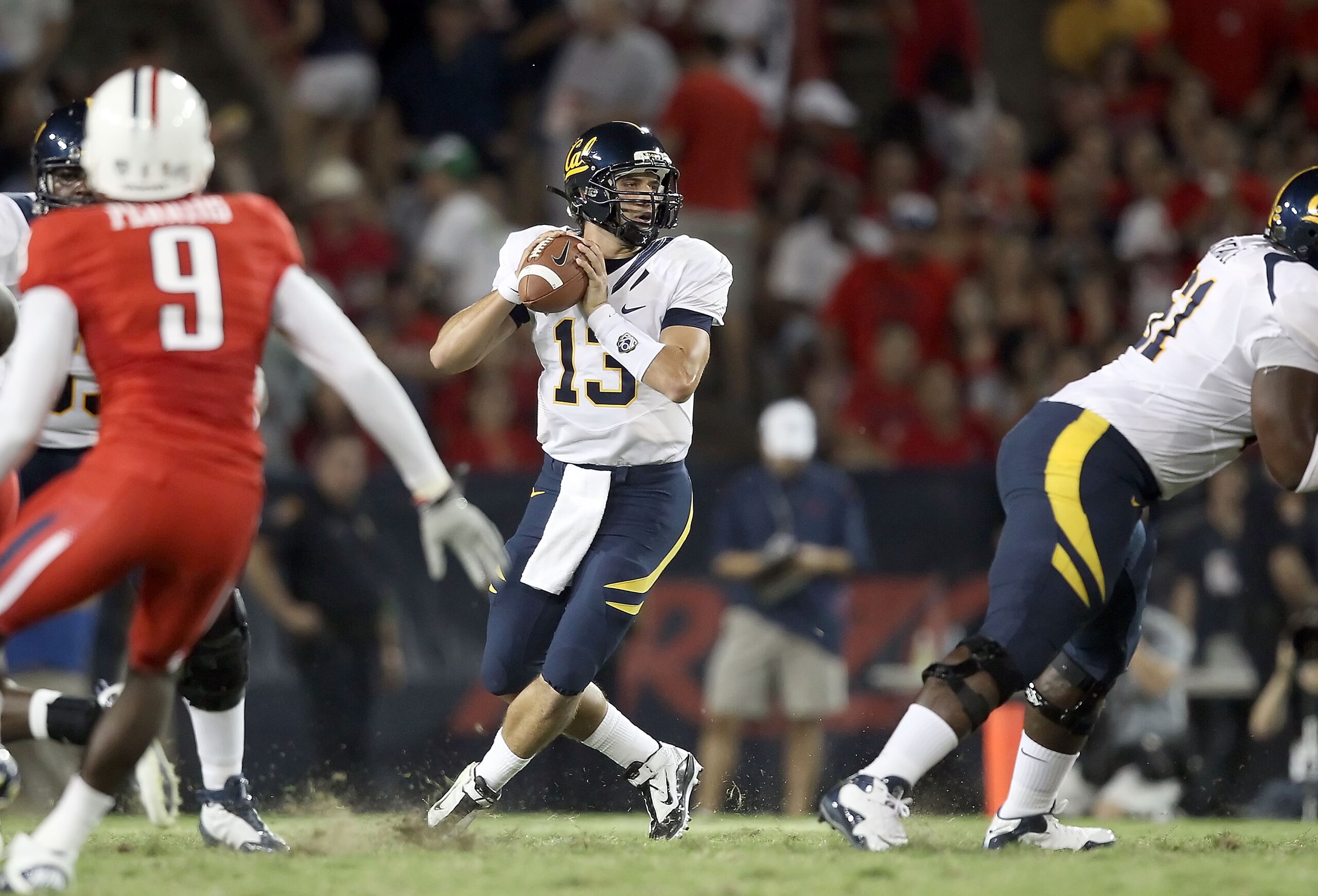 TUCSON, AZ - SEPTEMBER 25:  Quarterback Kevin Riley #13 of the California Golden Bears drops back to pass during the college football game against the Arizona Wildcats at Arizona Stadium on September 25, 2010 in Tucson, Arizona. The Wildcats defeated the 