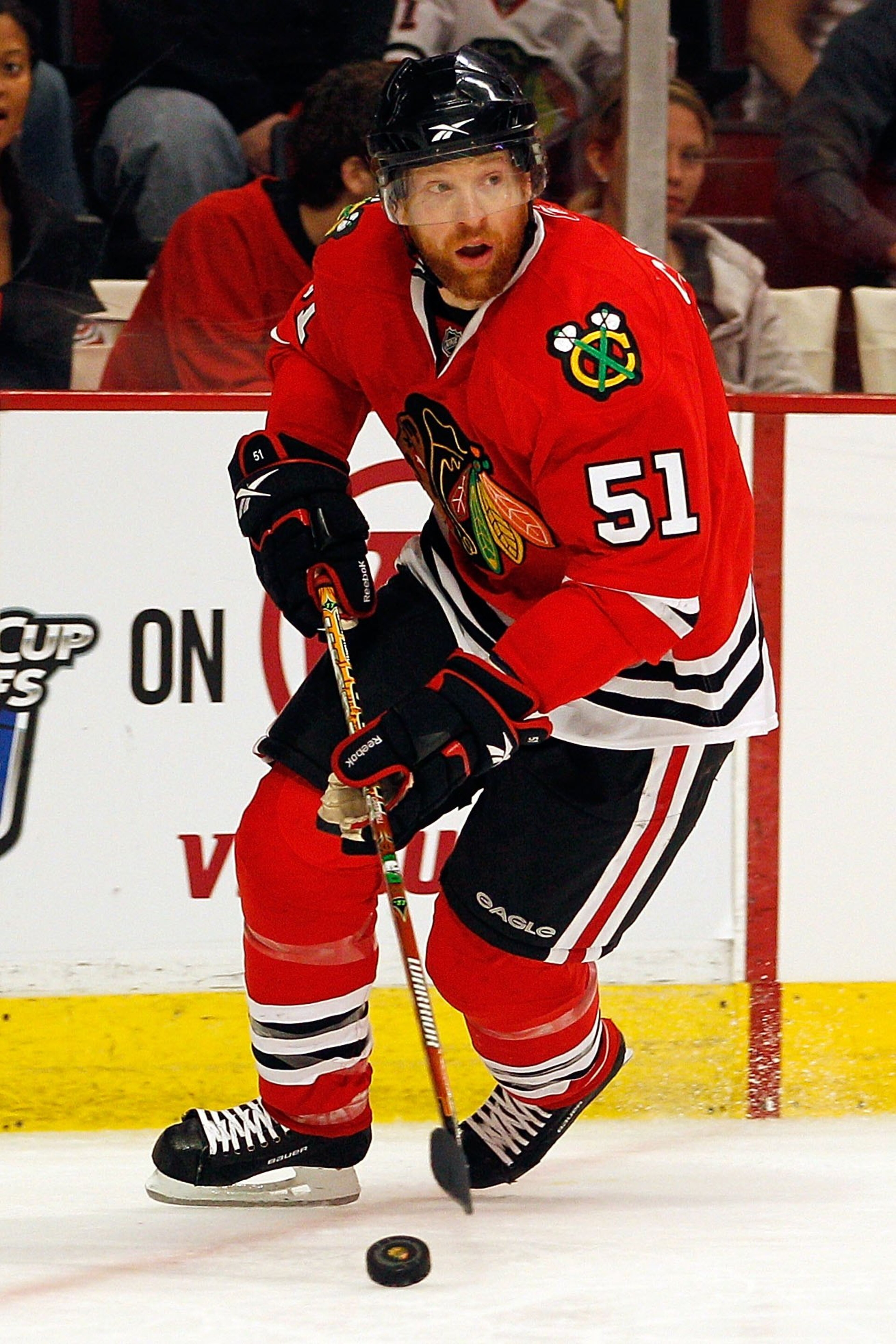 CHICAGO - MAY 21:  Brian Campbell #51 of the Chicago Blackhawks moves the puck while taking on the San Jose Sharks in Game Three of the Western Conference Finals during the 2010 NHL Stanley Cup Playoffs at the United Center on May 21, 2010 in Chicago, Ill