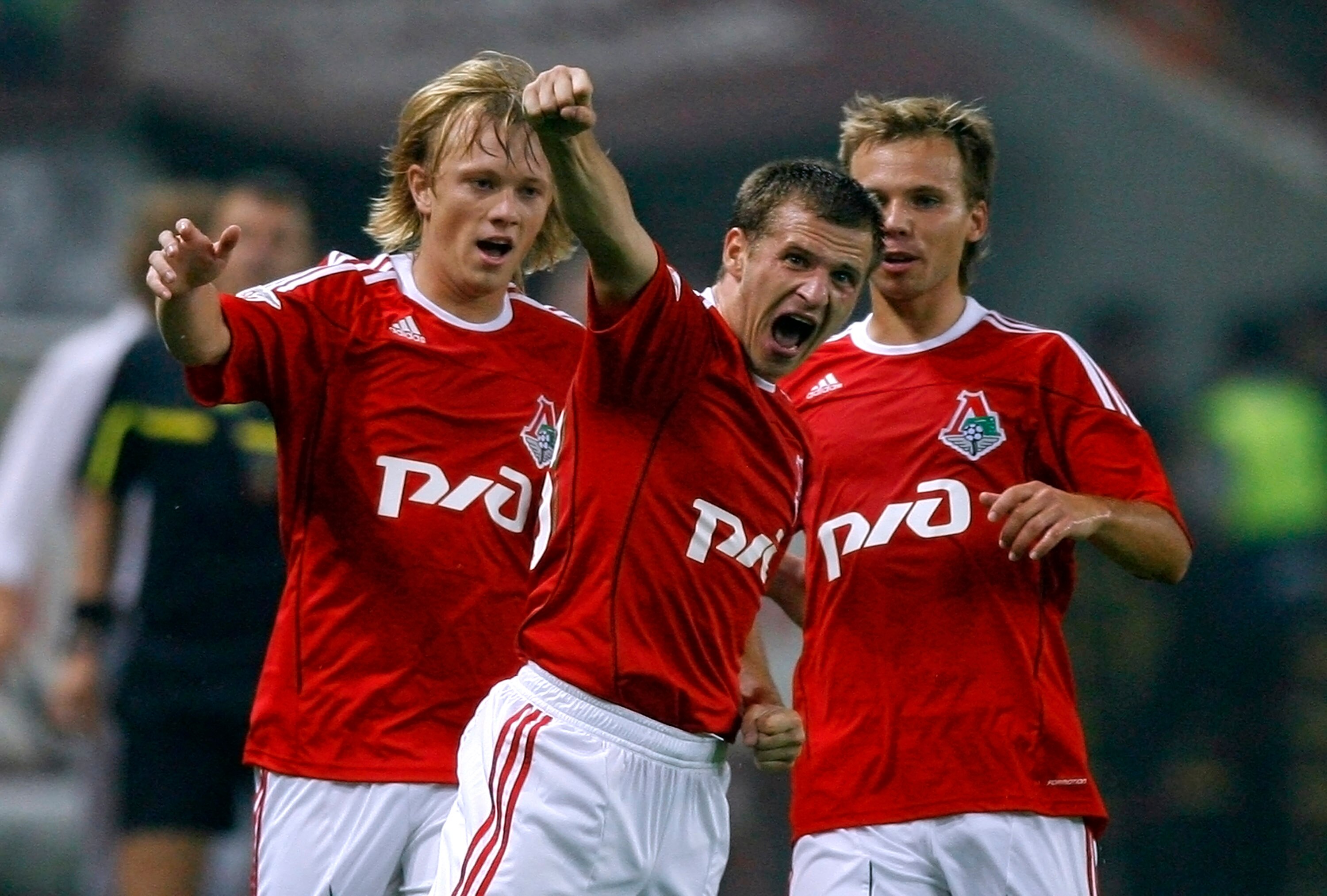 MOSCOW, RUSSIA - AUGUST 15: Alexander Aliev (C) of FC Lokomotiv Moscow celebrates after scoring a goal during the Russian Football League Championship match betweenFC Lokomotiv and FC Spartak at the Lokomotiv Stadium on August 15, 2010 in Moscow, Russia.