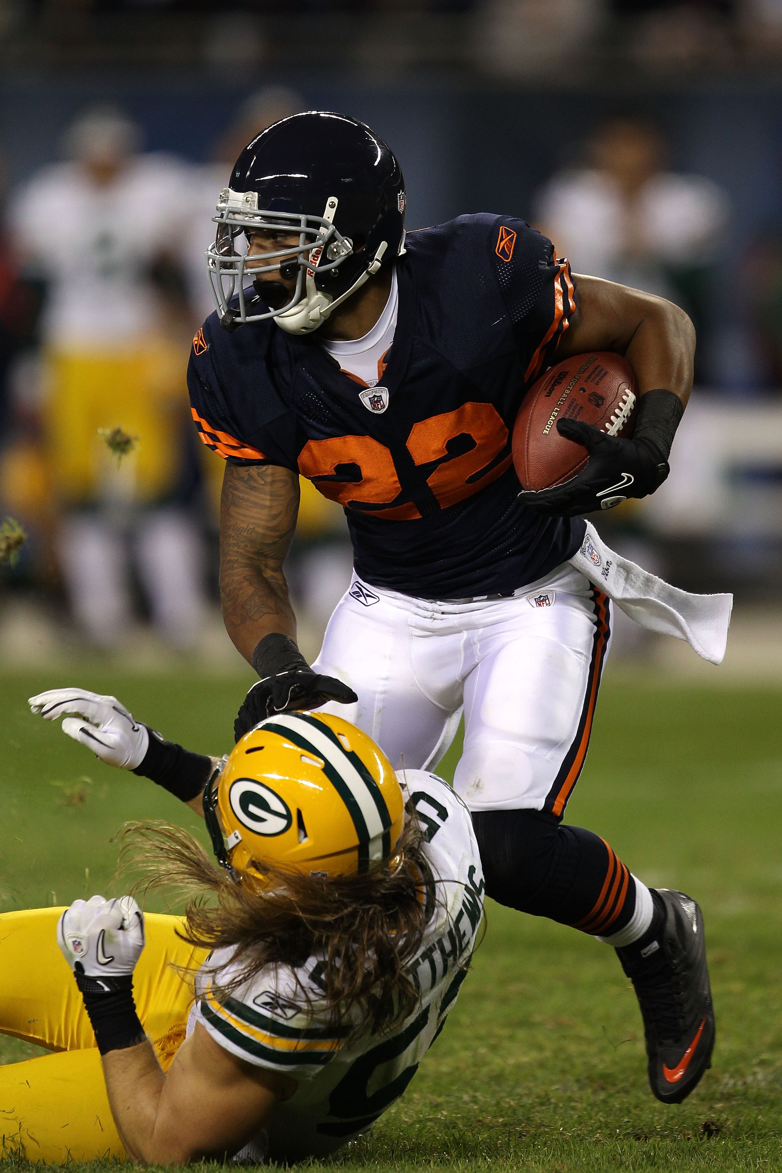 CHICAGO - SEPTEMBER 27:  Matt Forte #22 of the Chicago Bears runs the ball against Clay Matthews #52 of the Green Bay Packers at Soldier Field on September 27, 2010 in Chicago, Illinois.  (Photo by Jonathan Daniel/Getty Images)