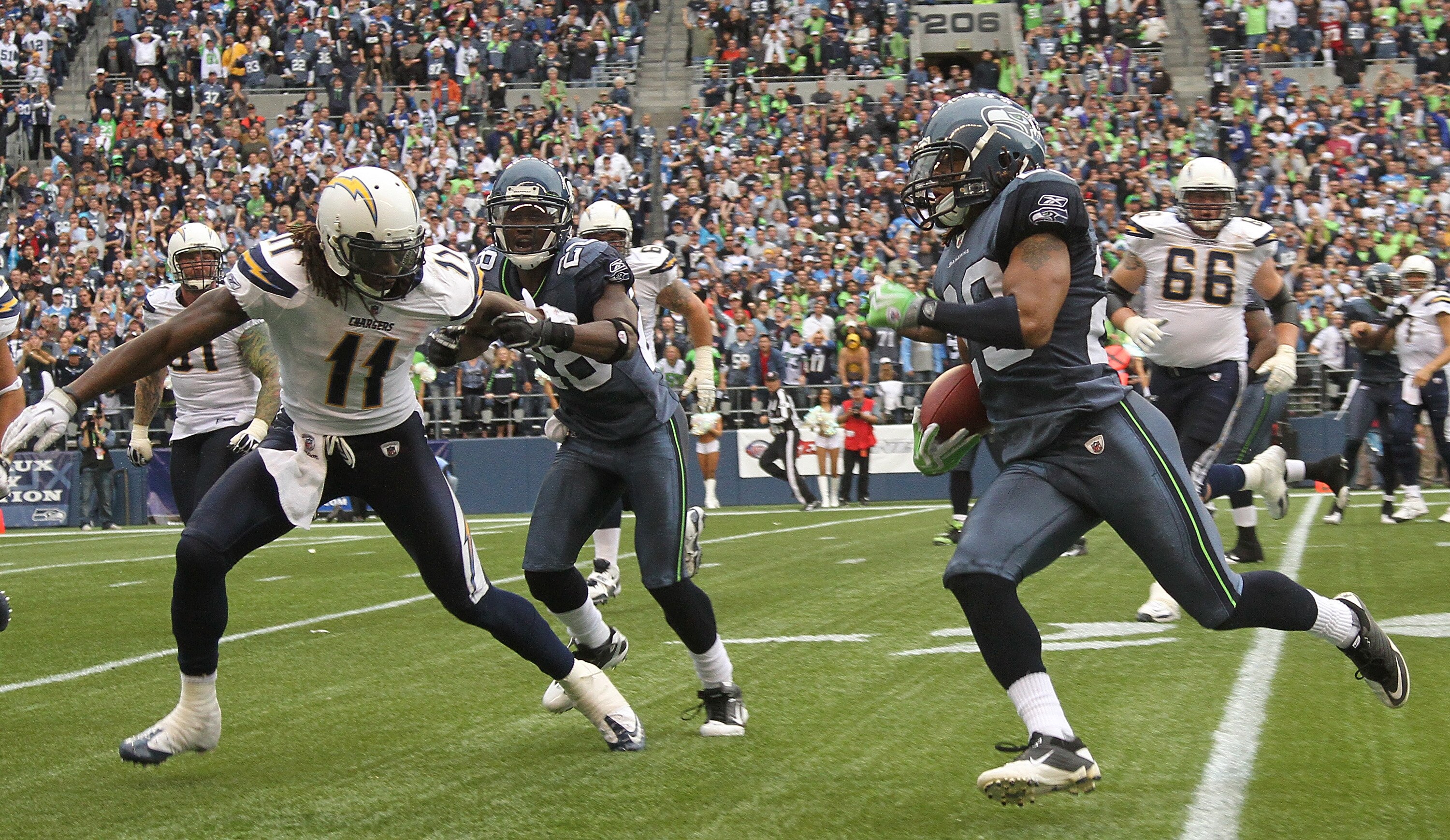 SEATTLE - SEPTEMBER 26:  Earl Thomas #29 of the Seattle Seahawks returns an interception against the Legedu Naanee #11 of San Diego Chargers at Qwest Field on September 26, 2010 in Seattle, Washington. The Seahawks defeated the Chargers 27-20. (Photo by O