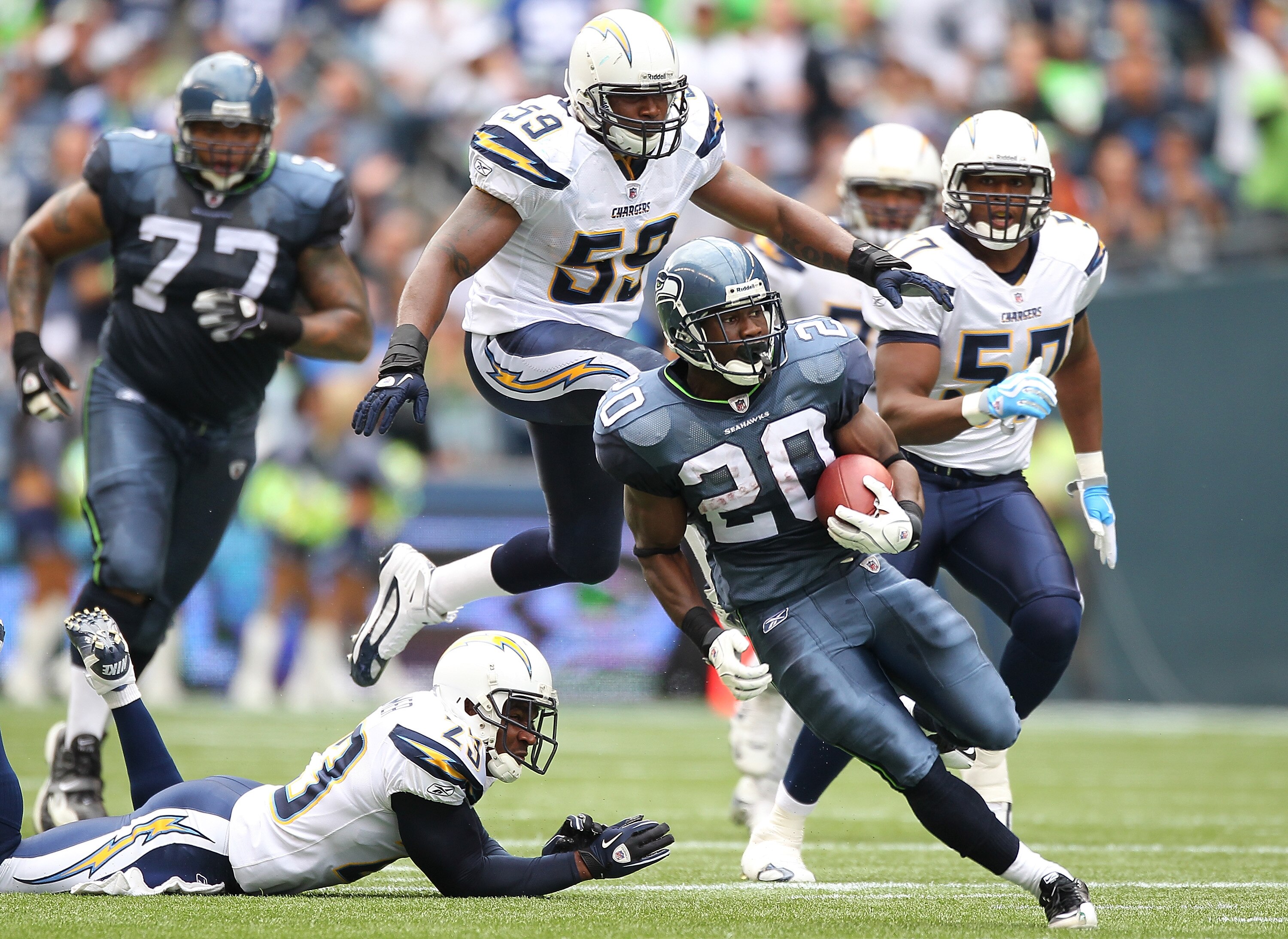 SEATTLE - SEPTEMBER 26:  Running back Justin Forsett #20 of the Seattle Seahawks rushes against Brandon Siler #59 of the San Diego Chargers at Qwest Field on September 26, 2010 in Seattle, Washington. (Photo by Otto Greule Jr/Getty Images)