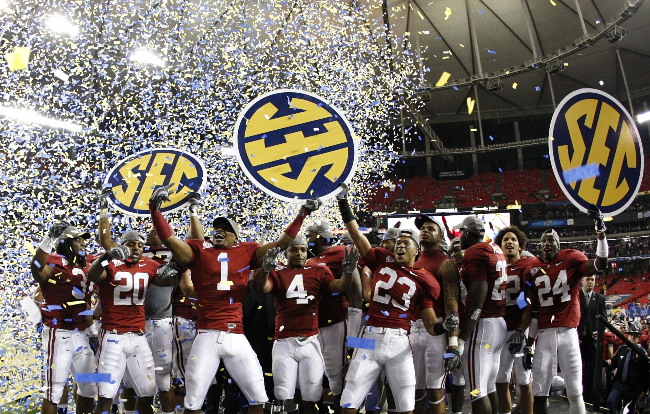ATLANTA - DECEMBER 5:  The Alabama Crimson Tide celebrate as confetti falls after their 32-13 win against the Florida Gators during the SEC Championship game at Georgia Dome on December 5, 2009 in Atlanta, Georgia.  (Photo by Kevin C. Cox/Getty Images)