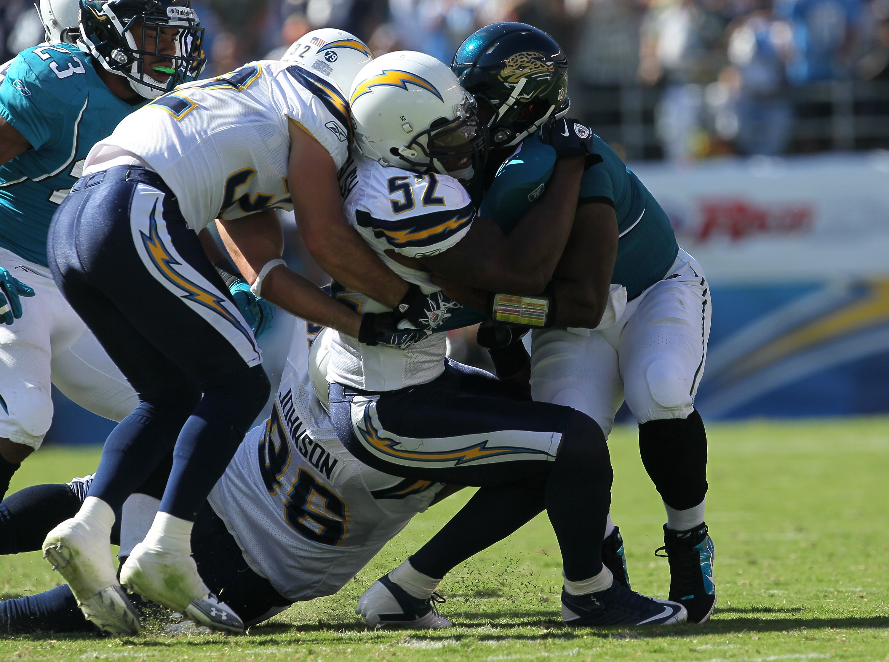 SAN DIEGO - SEPTEMBER 19:  Quarterback David Garrard #9 of the Jacksonville Jaguars is sacked by linebacker Larry English #52 and safety Eric Weddle #32 of the San Diego Chargers at Qualcomm Stadium on September 19, 2010 in San Diego, California.   The Ch