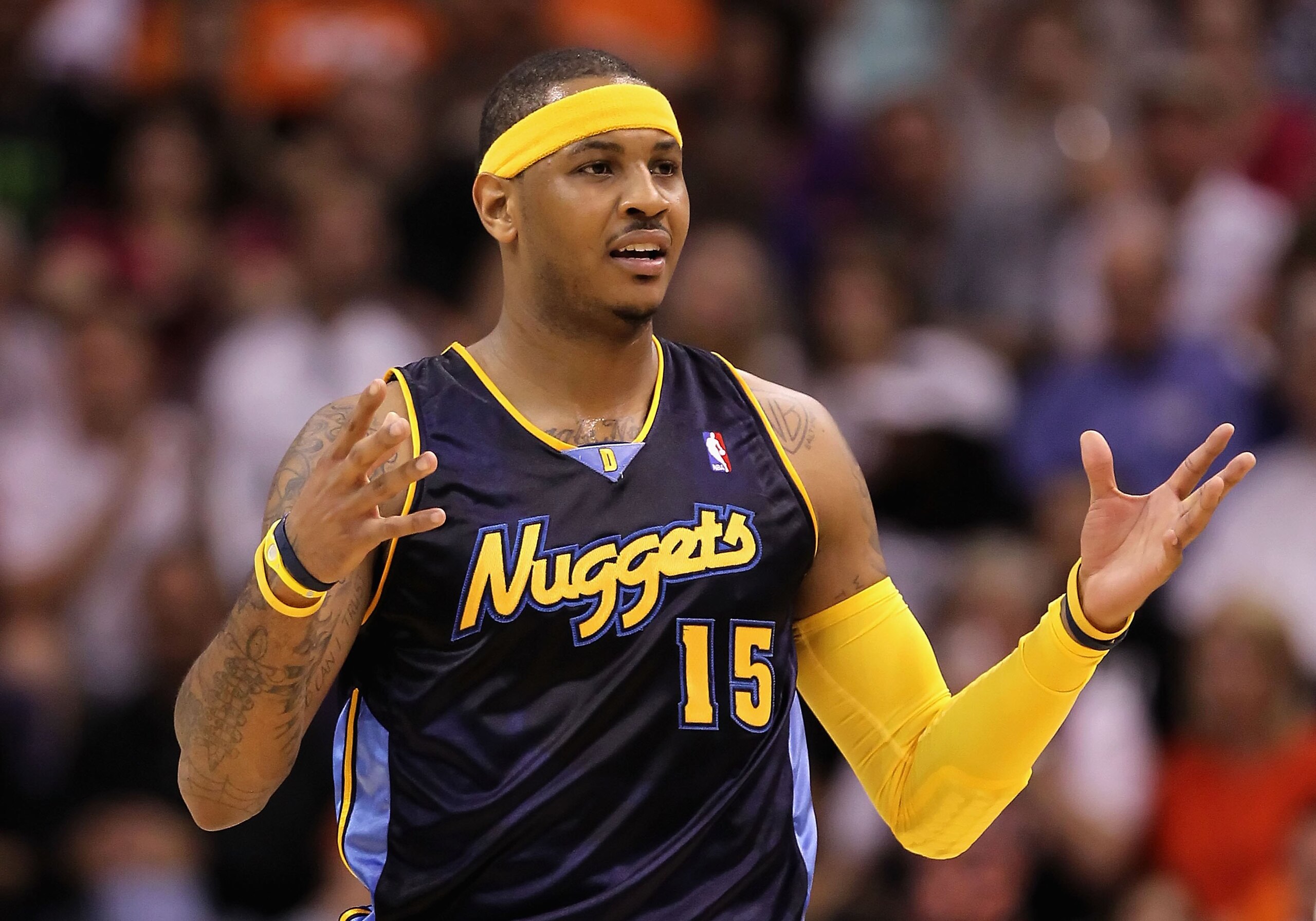 PHOENIX - APRIL 13: Carmelo Anthony #15 of the Denver Nuggets reacts during the NBA game against the Phoenix Suns at US Airways Center on April 13, 2010 in Phoenix, Arizona. The Suns defeated the Nuggets 123-101. NOTE TO USER: User expressly acknowledge PHOENIX - APRIL 13: Carmelo Anthony #15 of the Denver Nuggets reacts during the NBA game against the Phoenix Suns at US Airways Center on April 13, 2010 in Phoenix, Arizona. The Suns defeated the Nuggets 123-101. NOTE TO USER: User expressly acknowledge
