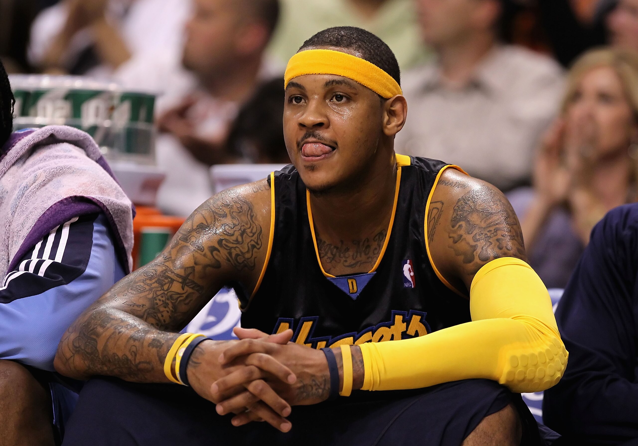PHOENIX - APRIL 13: Carmelo Anthony #15 of the Denver Nuggets reacts on the bench during the NBA game against the Phoenix Suns at US Airways Center on April 13, 2010 in Phoenix, Arizona. The Suns defeated the Nuggets 123-101. NOTE TO USER: User expressl PHOENIX - APRIL 13: Carmelo Anthony #15 of the Denver Nuggets reacts on the bench during the NBA game against the Phoenix Suns at US Airways Center on April 13, 2010 in Phoenix, Arizona. The Suns defeated the Nuggets 123-101. NOTE TO USER: User expressl