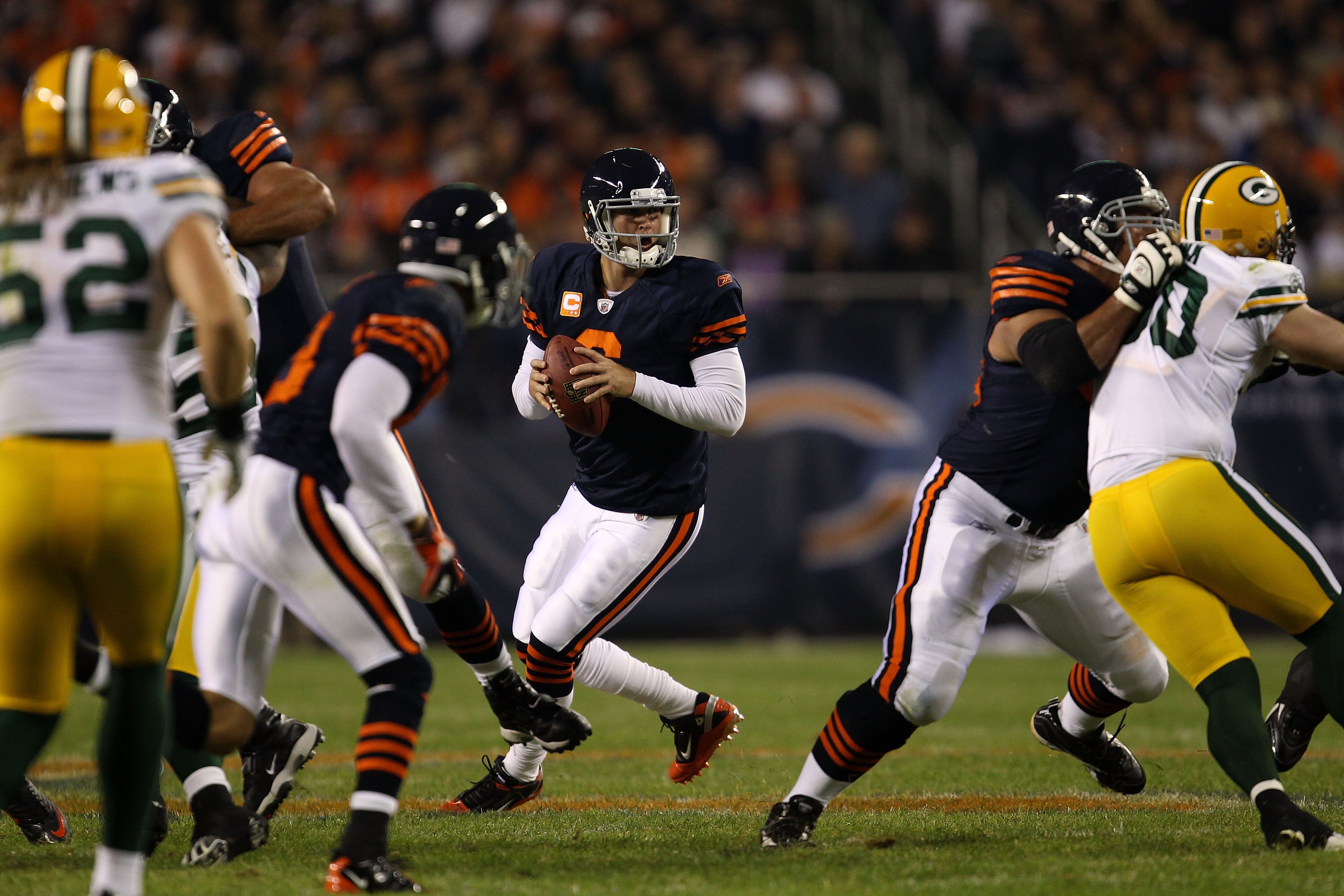 CHICAGO - SEPTEMBER 27:  Jay Cutler #6 of the Chicago Bears rolls out to pass against the Green Bay Packers at Soldier Field on September 27, 2010 in Chicago, Illinois.  (Photo by Jonathan Daniel/Getty Images)