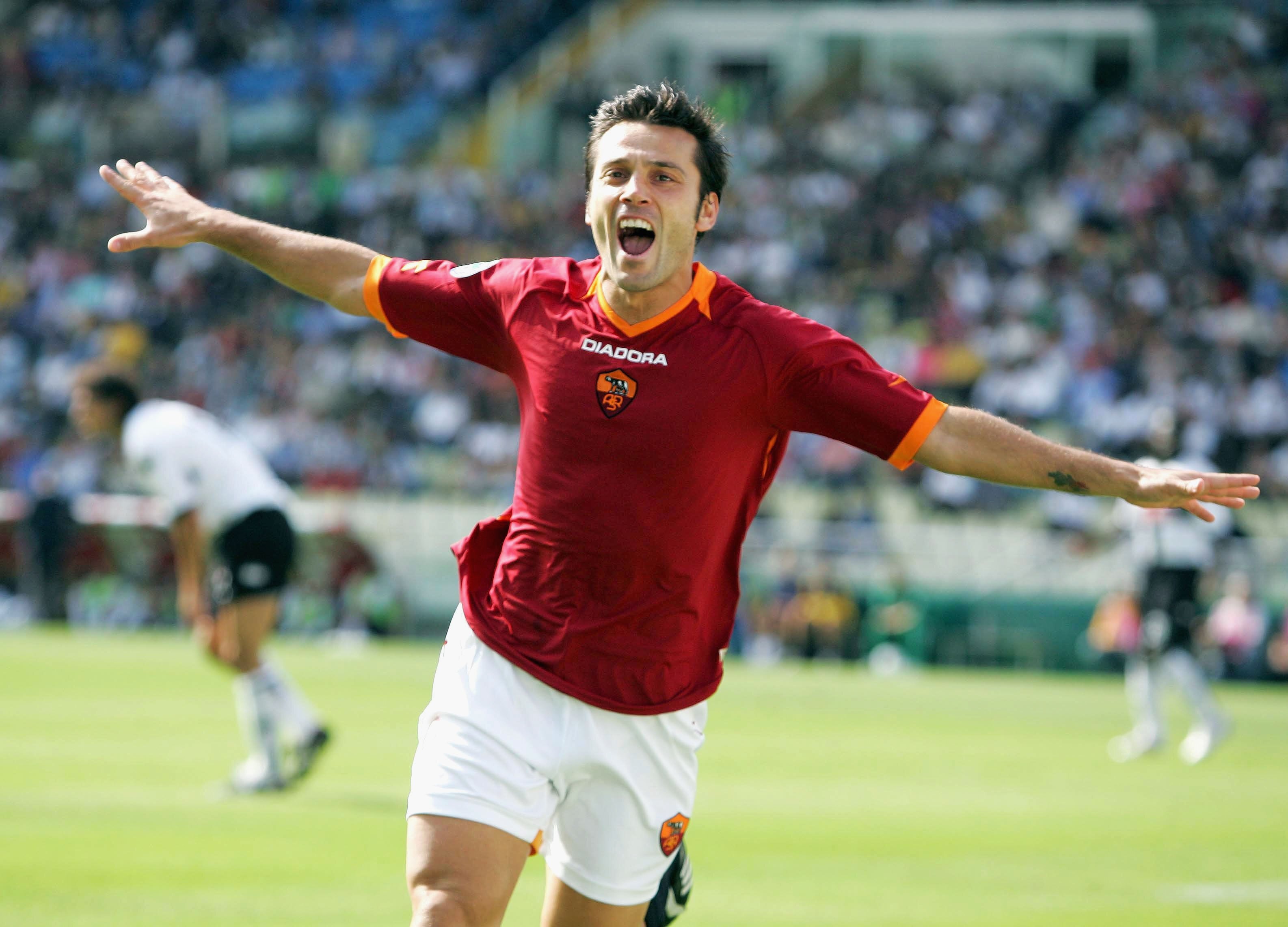 PARMA, ITALY - SEPTEMBER 24: Vincenzo Montellaiof Roma celebrates the opening goal during the Seria A game between Parma and Roma on September 24, 2006 at the Ennio Tardini stadium in Parma, Italy. (Photo by New Press/Getty Images)