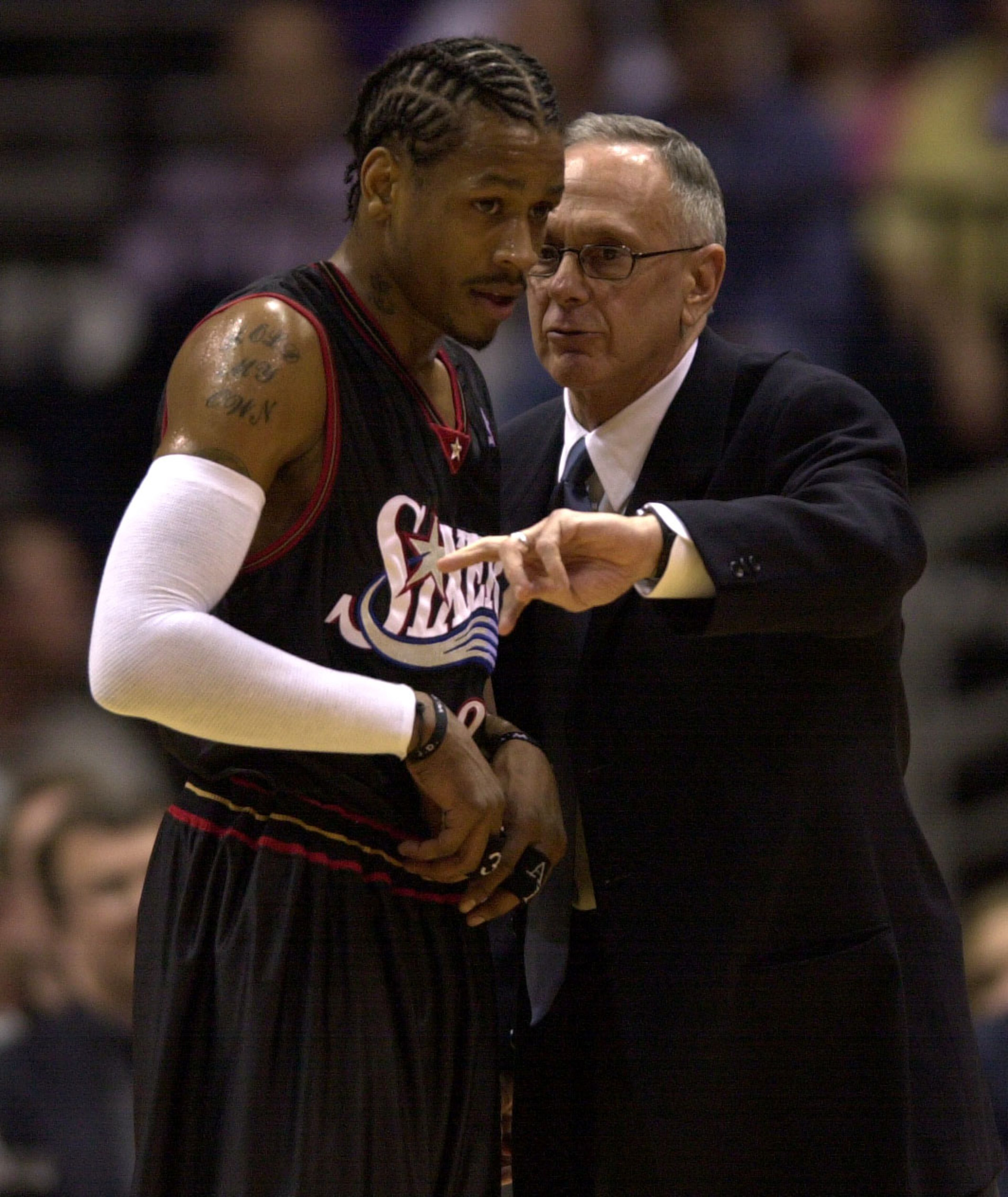 28 May 2001:  Allen Iverson #3 of the Philadelphia 76ers, left, receives instruction from Sixers head coach Larry Brown during game four of the NBA Eastern Conference Finals against the Milwaukee Bucks at the Bradley Center in Milwaukee, Wisconsin. The 76