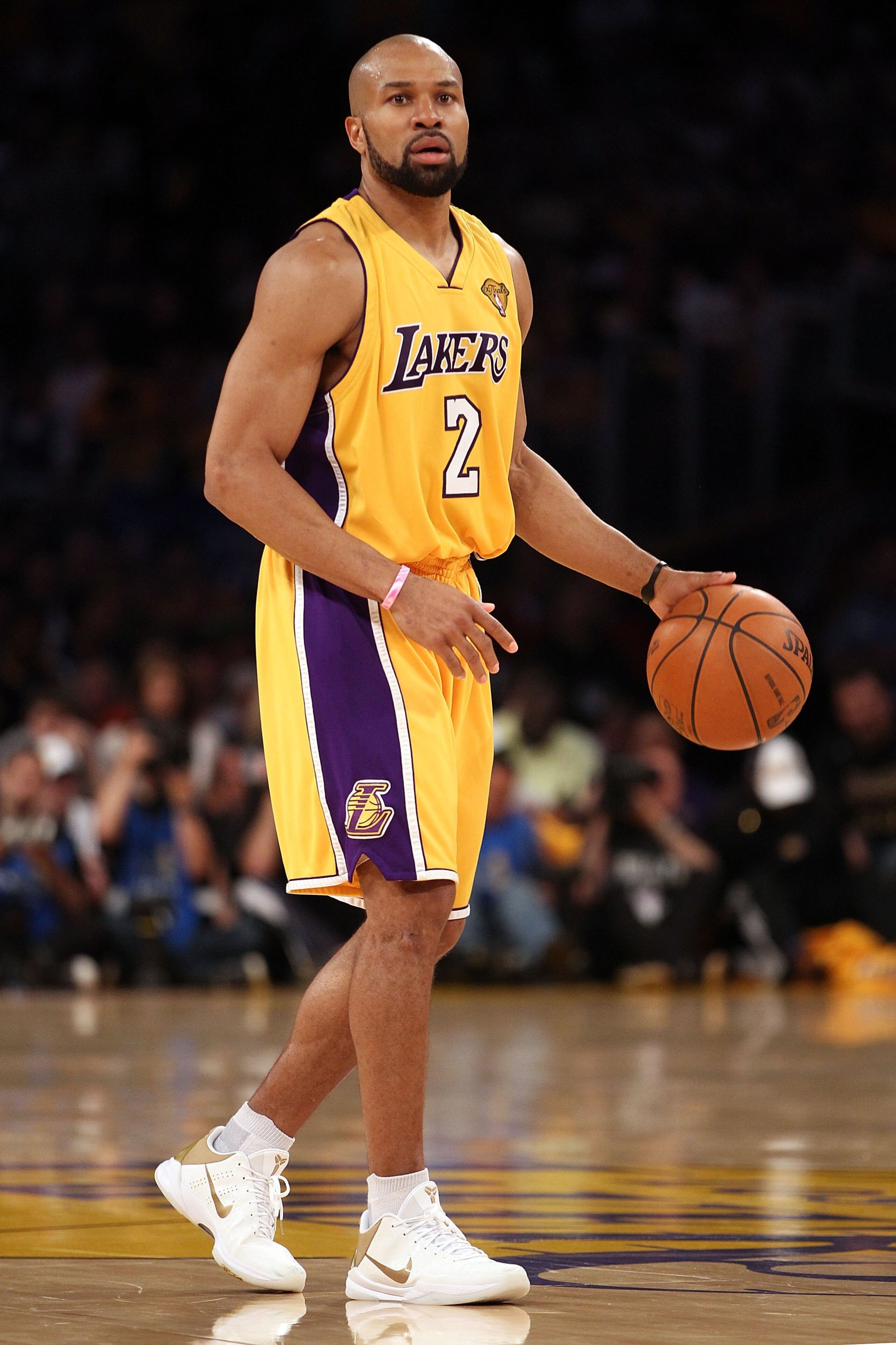 LOS ANGELES, CA - JUNE 17: Derek Fisher #2 of the Los Angeles Lakers moves the ball in Game Seven of the 2010 NBA Finals against the Boston Celtics at Staples Center on June 17, 2010 in Los Angeles, California. NOTE TO USER: User expressly acknowledges LOS ANGELES, CA - JUNE 17: Derek Fisher #2 of the Los Angeles Lakers moves the ball in Game Seven of the 2010 NBA Finals against the Boston Celtics at Staples Center on June 17, 2010 in Los Angeles, California. NOTE TO USER: User expressly acknowledges