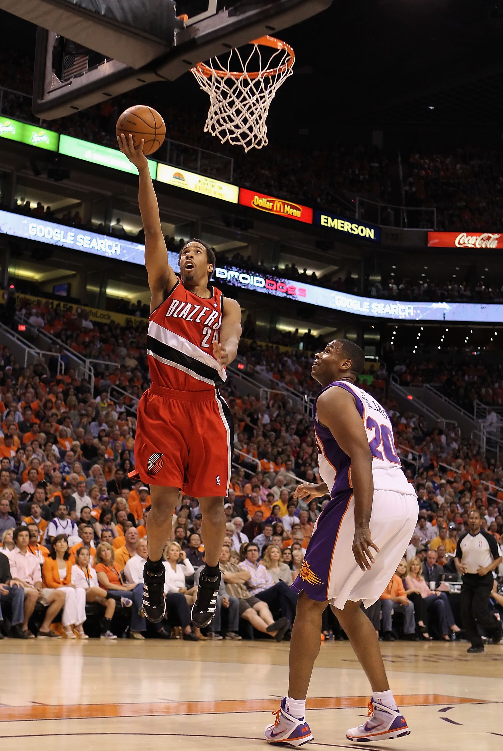 PHOENIX - APRIL 18:  Andre Miller #24 of the Portland Trail Blazers lays up a shot over Jarron Collins #20 of the Phoenix Suns during Game One of the Western Conference Quarterfinals of the 2010 NBA Playoffs at US Airways Center on April 18, 2010 in Phoen