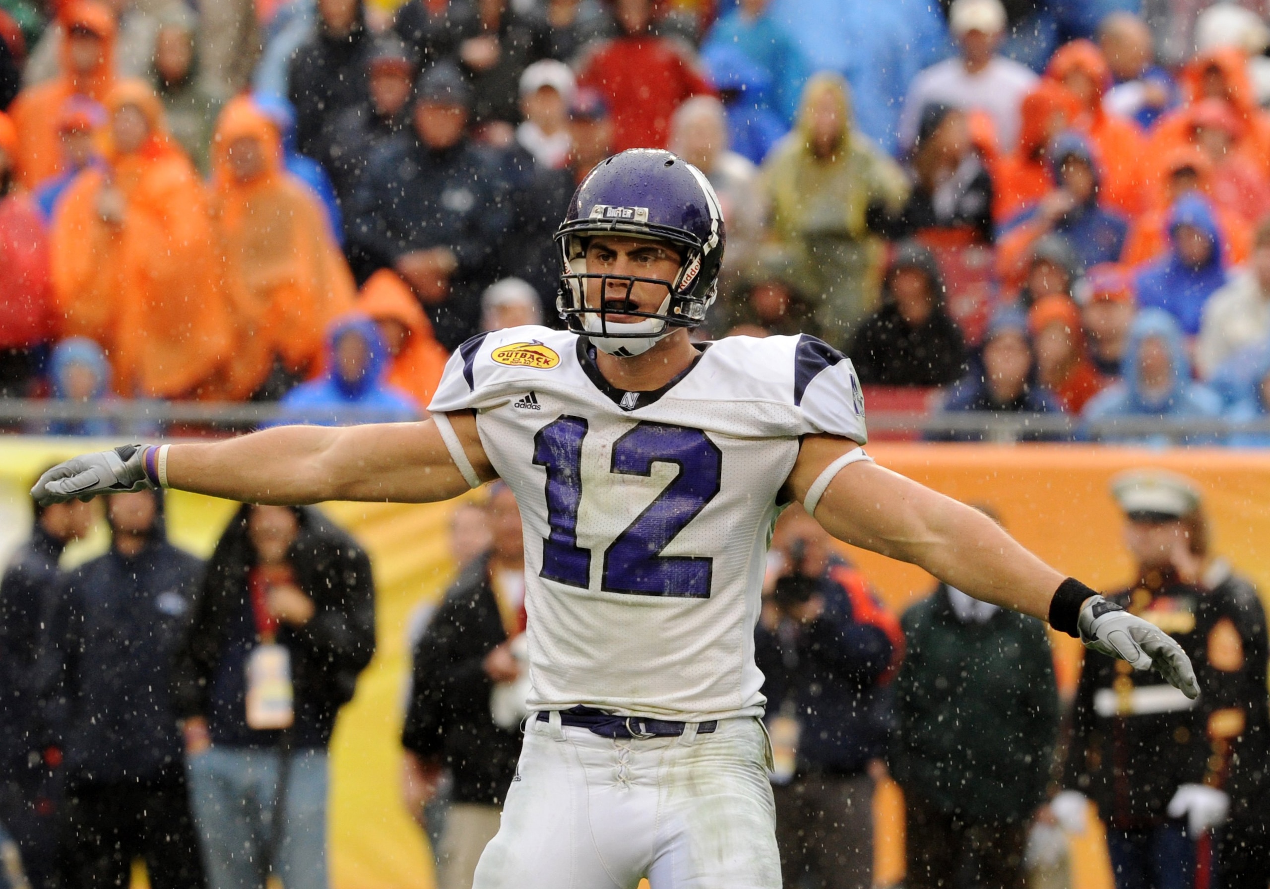 TAMPA, FL - JANUARY 1: Wide receiver Andrew Brewer #12 of the Northwestern Wildcats looks for a play in the rain against the Auburn Tigers in the Outback Bowl January 1, 2010 at Raymond James Stadium in Tampa, Florida.  (Photo by Al Messerschmidt/Getty Im