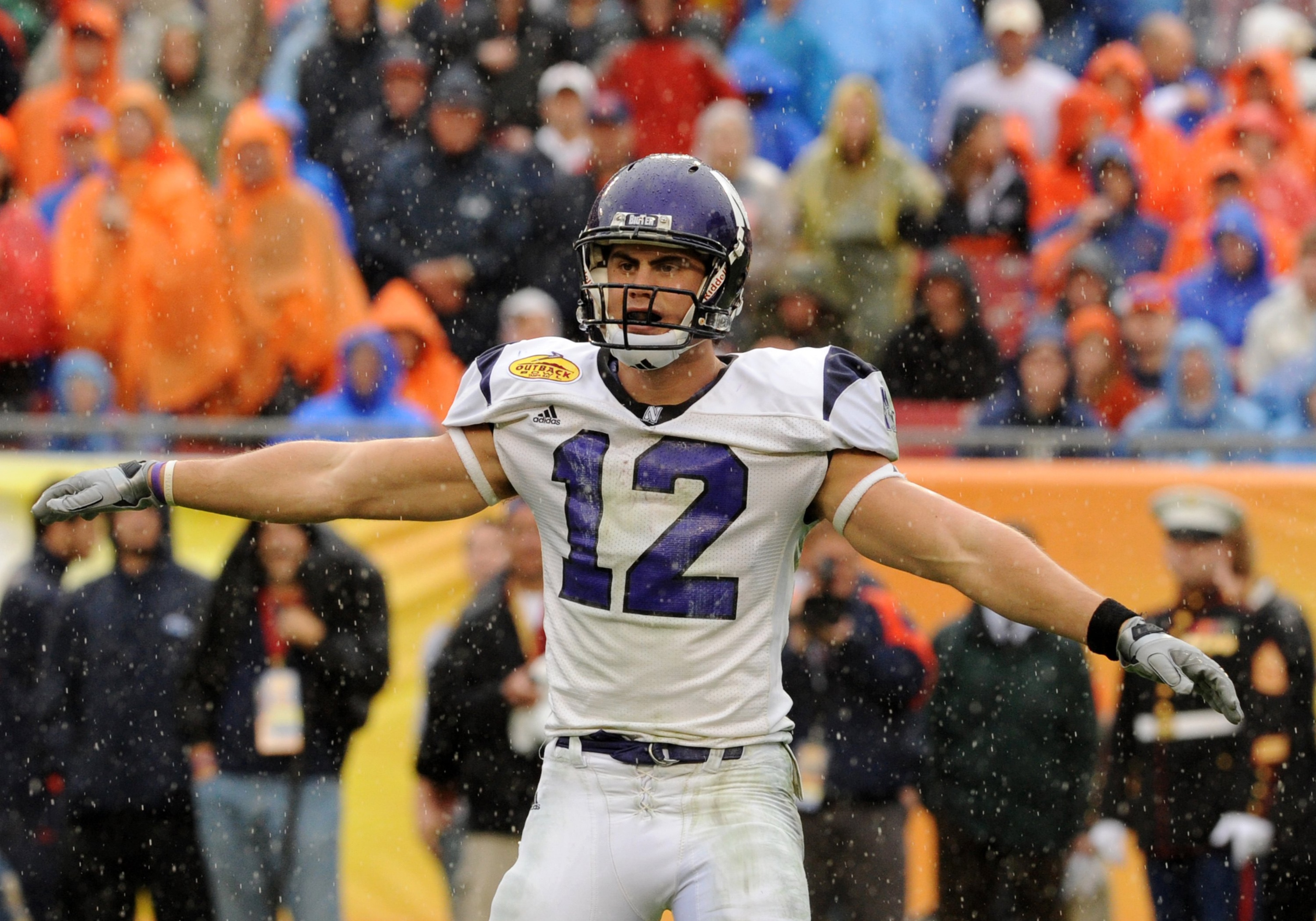 TAMPA, FL - JANUARY 1: Wide receiver Andrew Brewer #12 of the Northwestern Wildcats looks for a play in the rain against the Auburn Tigers in the Outback Bowl January 1, 2010 at Raymond James Stadium in Tampa, Florida.  (Photo by Al Messerschmidt/Getty Im