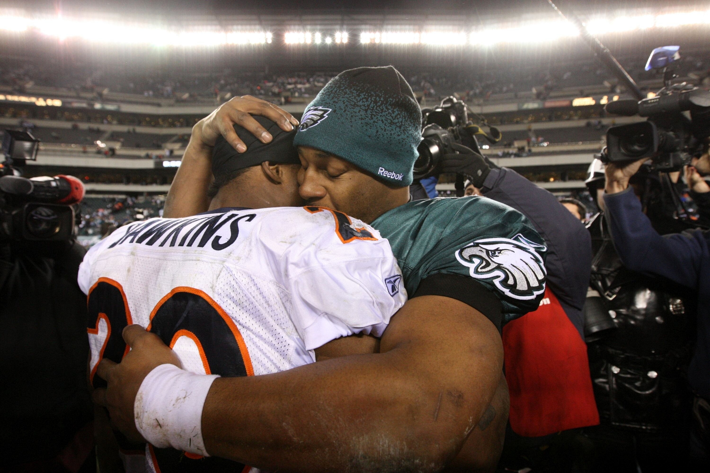 PHILADELPHIA - DECEMBER 27 : Donovan McNabb #5 of the Philadelphia Eagles hugs Brian Dawkins #20 of the Denver Broncos after the game at Lincoln Financial Field on December 27, 2009 in Philadelphia, Pennsylvania. The Broncos were defeated by the Eagles wi