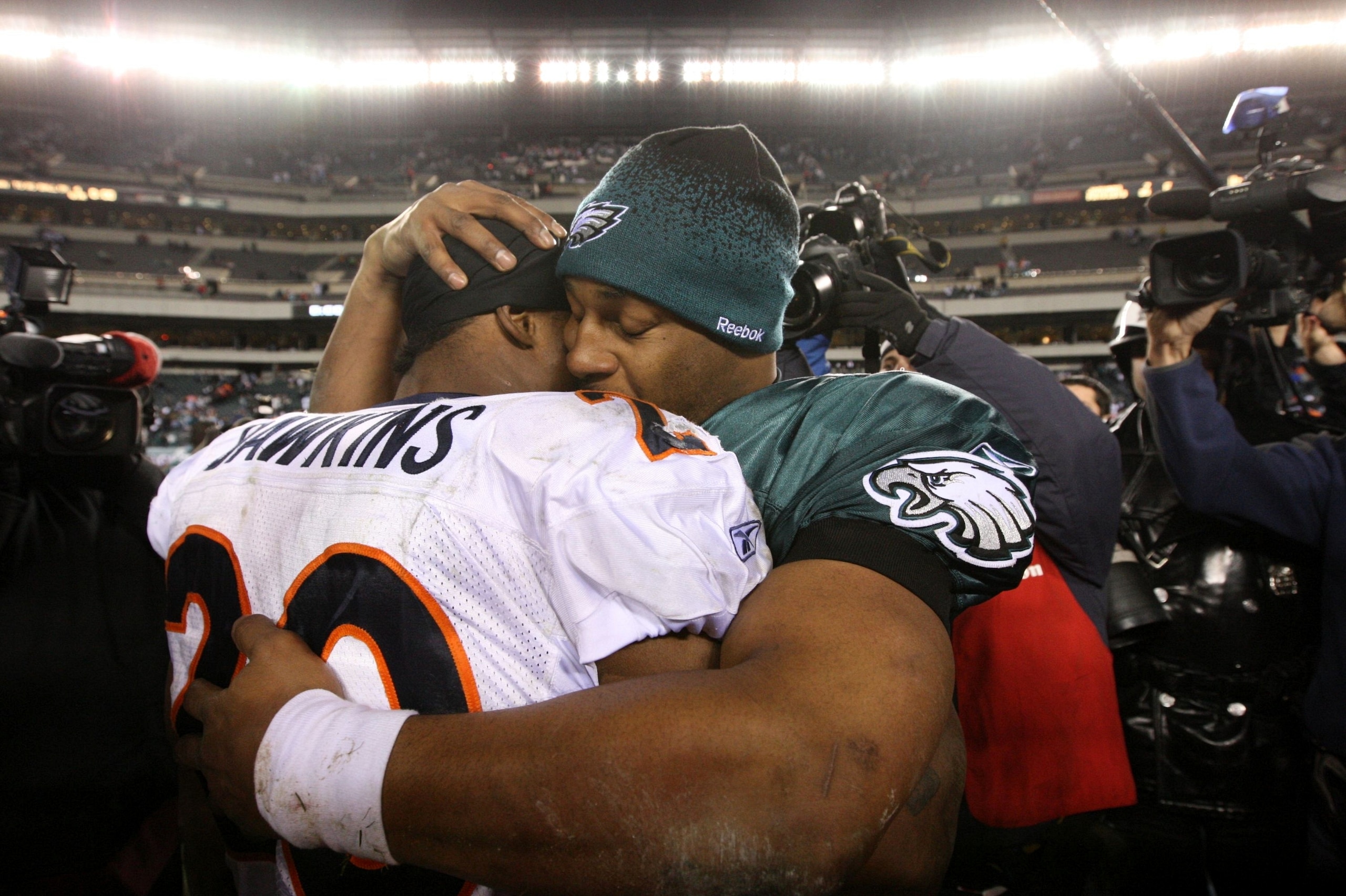 PHILADELPHIA - DECEMBER 27 : Donovan McNabb #5 of the Philadelphia Eagles hugs Brian Dawkins #20 of the Denver Broncos after the game at Lincoln Financial Field on December 27, 2009 in Philadelphia, Pennsylvania. The Broncos were defeated by the Eagles wi