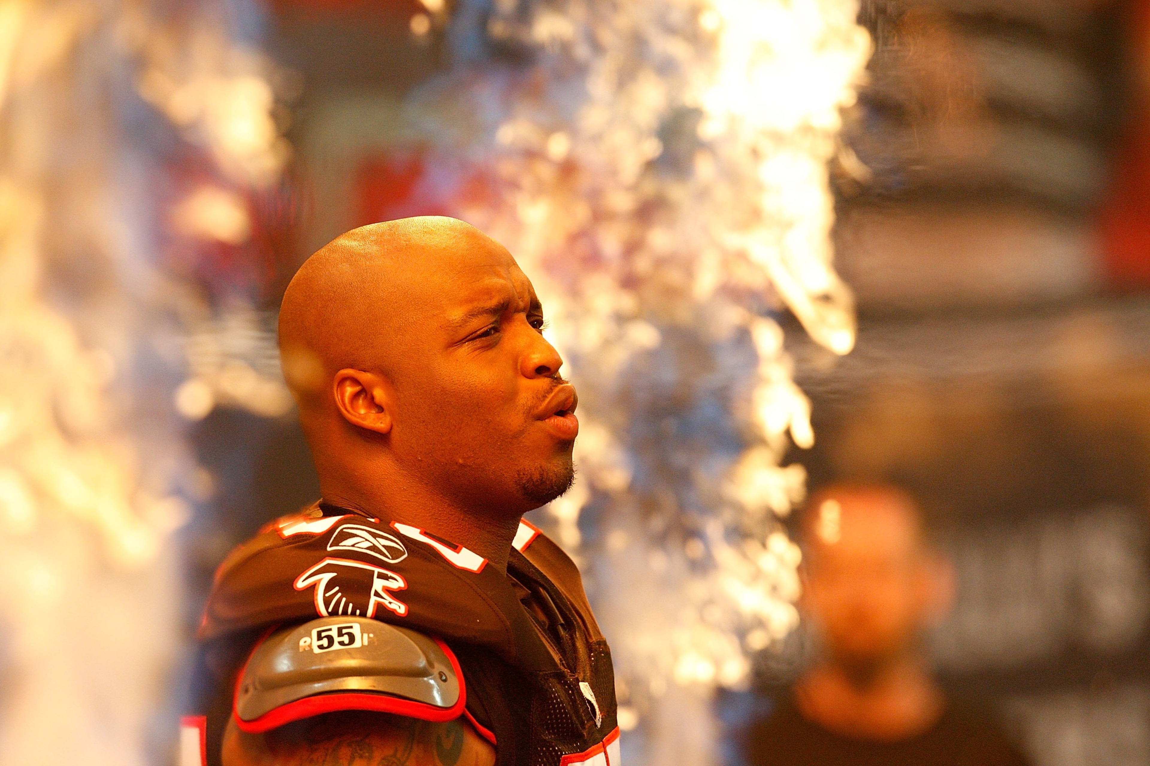 ATLANTA - SEPTEMBER 20:  John Abraham #55 of the Atlanta Falcons enters the field to face the Carolina Panthers at Georgia Dome on September 20, 2009 in Atlanta, Georgia.  (Photo by Kevin C. Cox/Getty Images)