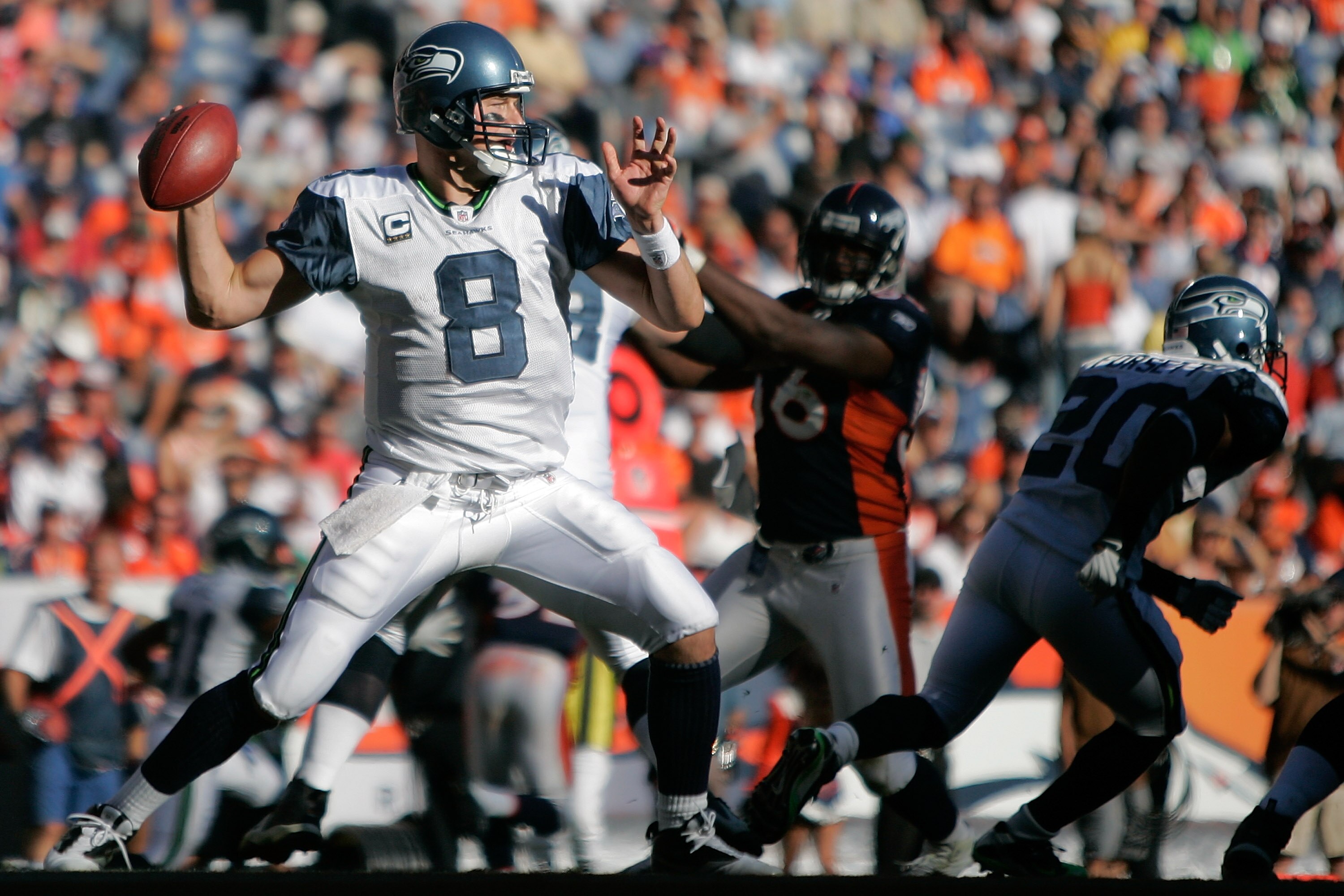 DENVER - SEPTEMBER 19:  Quarterback Matt Hasselbeck #8 of the Seattle Seahawks makes a pass against the Denver Broncos during NFL action at INVESCO Field at Mile High on September 19, 2010 in Denver, Colorado.  (Photo by Justin Edmonds/Getty Images)
