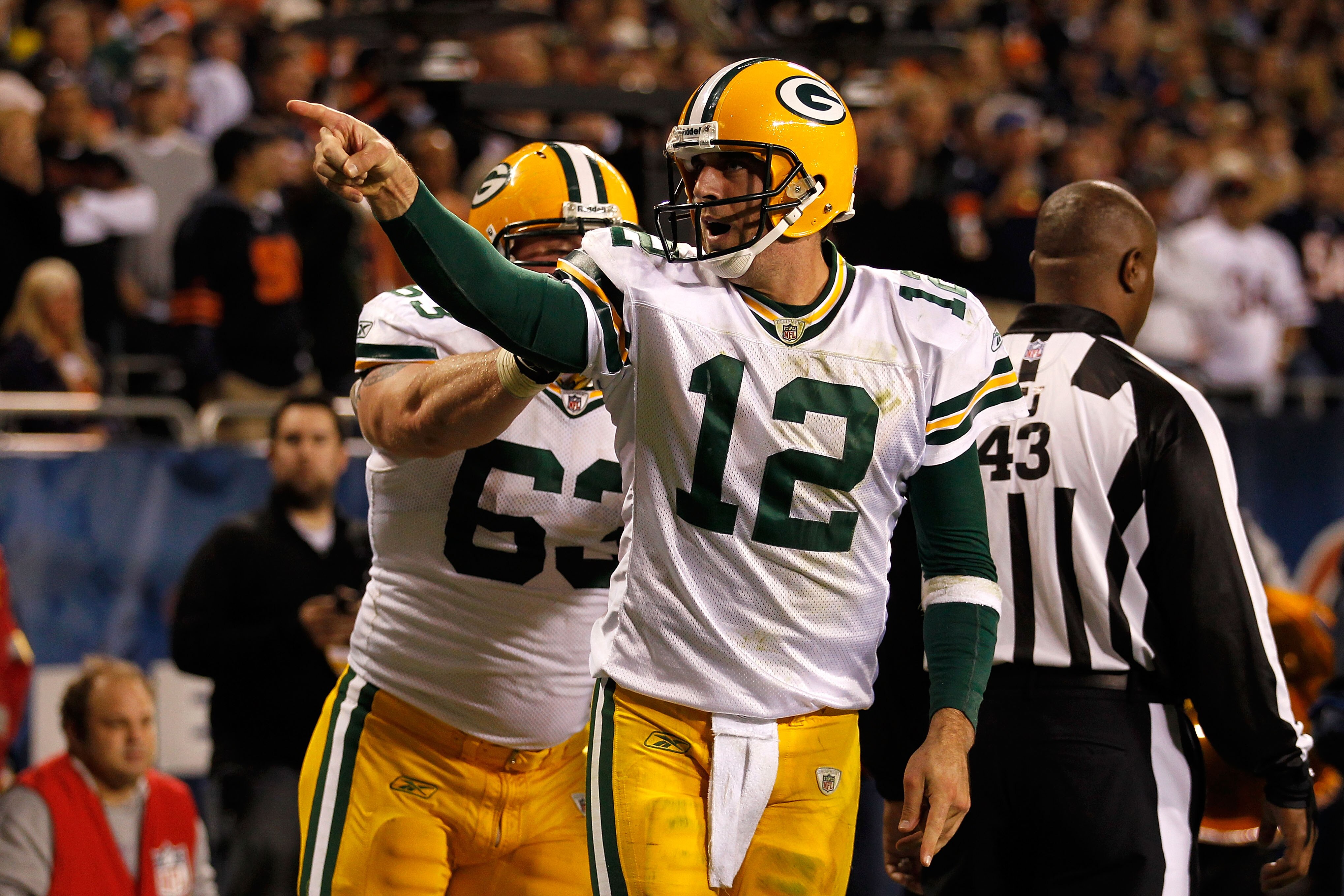 CHICAGO - SEPTEMBER 27:  Aaron Rodgers (R) #12 and Scott Wells #63 of  the Green Bay Packers celebrate after Rodgers scored a 3-yard rushing touchdown in the fourth quarter against the Chicago Bears at Soldier Field on September 27, 2010 in Chicago, Illin