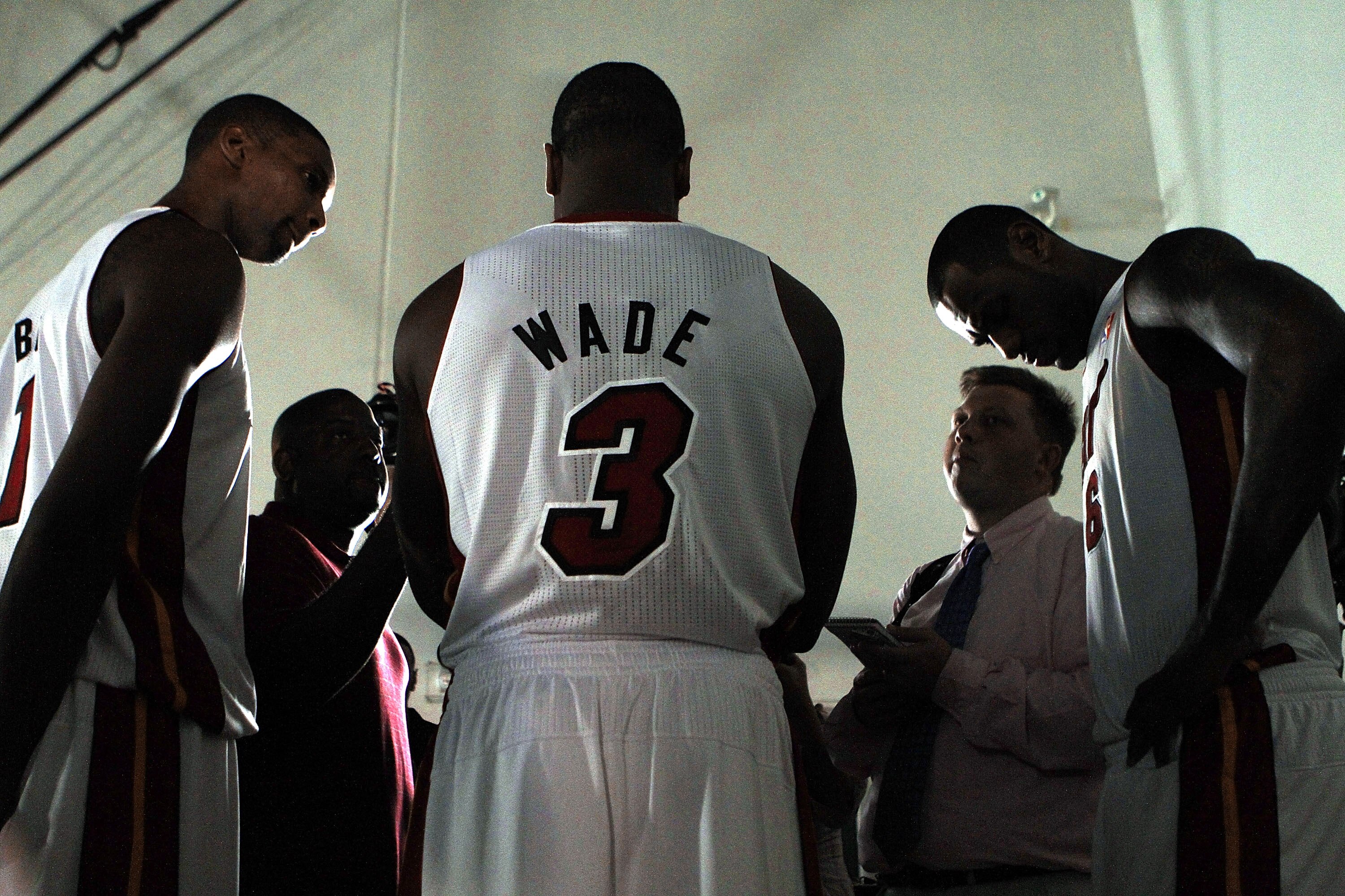 MIAMI - SEPTEMBER 27:  Dwyane Wade (C) of the Miami Heat is flanked by teammates Chris Bosh (L) and LeBron James (R) as they answer questions during media day at the Bank United Center on September 27, 2010 in Miami, Florida. NOTE TO USER: User expressly