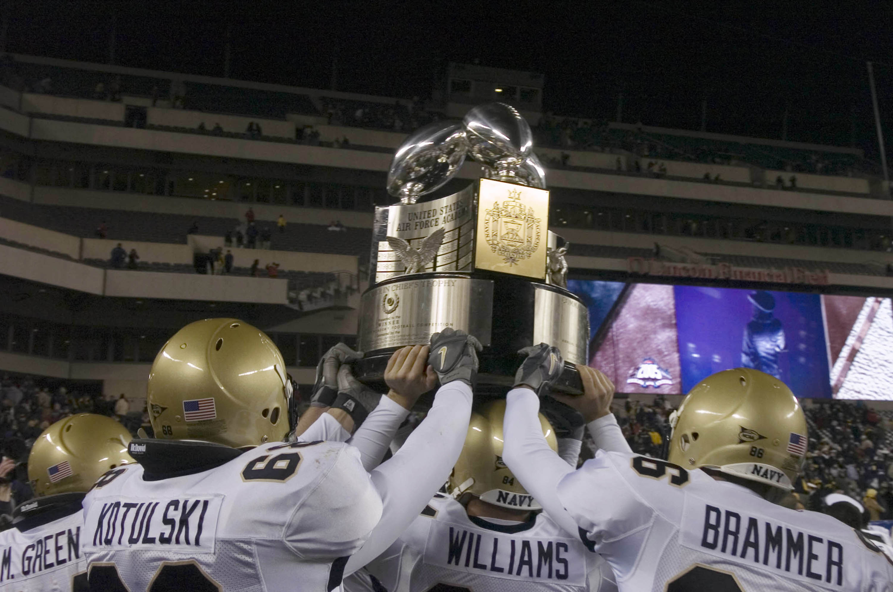 PHILADELPHIA - DECEMBER 3:  In this handout provided by the U.S. Navy, Navy players hold the Commander-in-Chief's Trophy following a 42-23 victory over the Black Knights of Army in the 106th Army vs. Navy football game on December 3, 2005 held for the thi