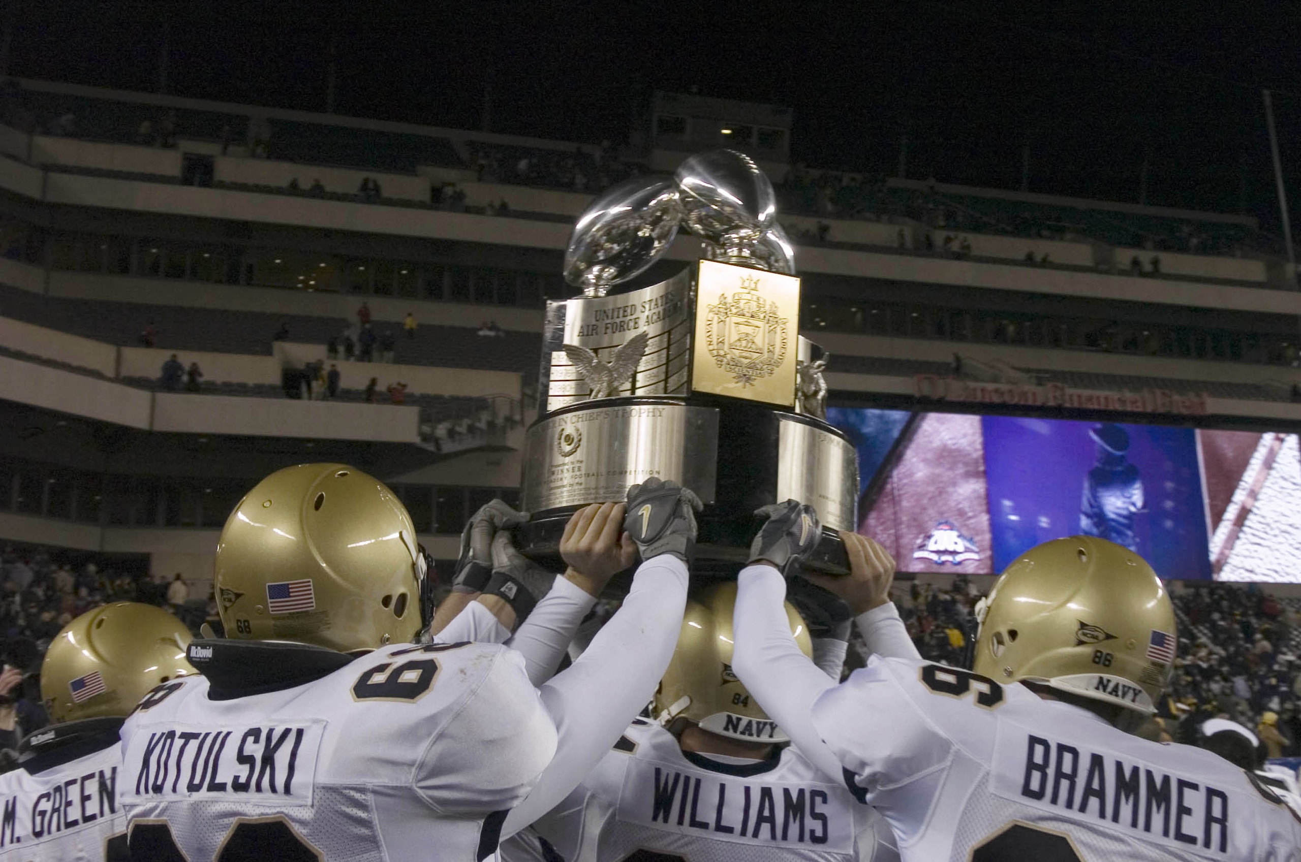 PHILADELPHIA - DECEMBER 3:  In this handout provided by the U.S. Navy, Navy players hold the Commander-in-Chief's Trophy following a 42-23 victory over the Black Knights of Army in the 106th Army vs. Navy football game on December 3, 2005 held for the thi