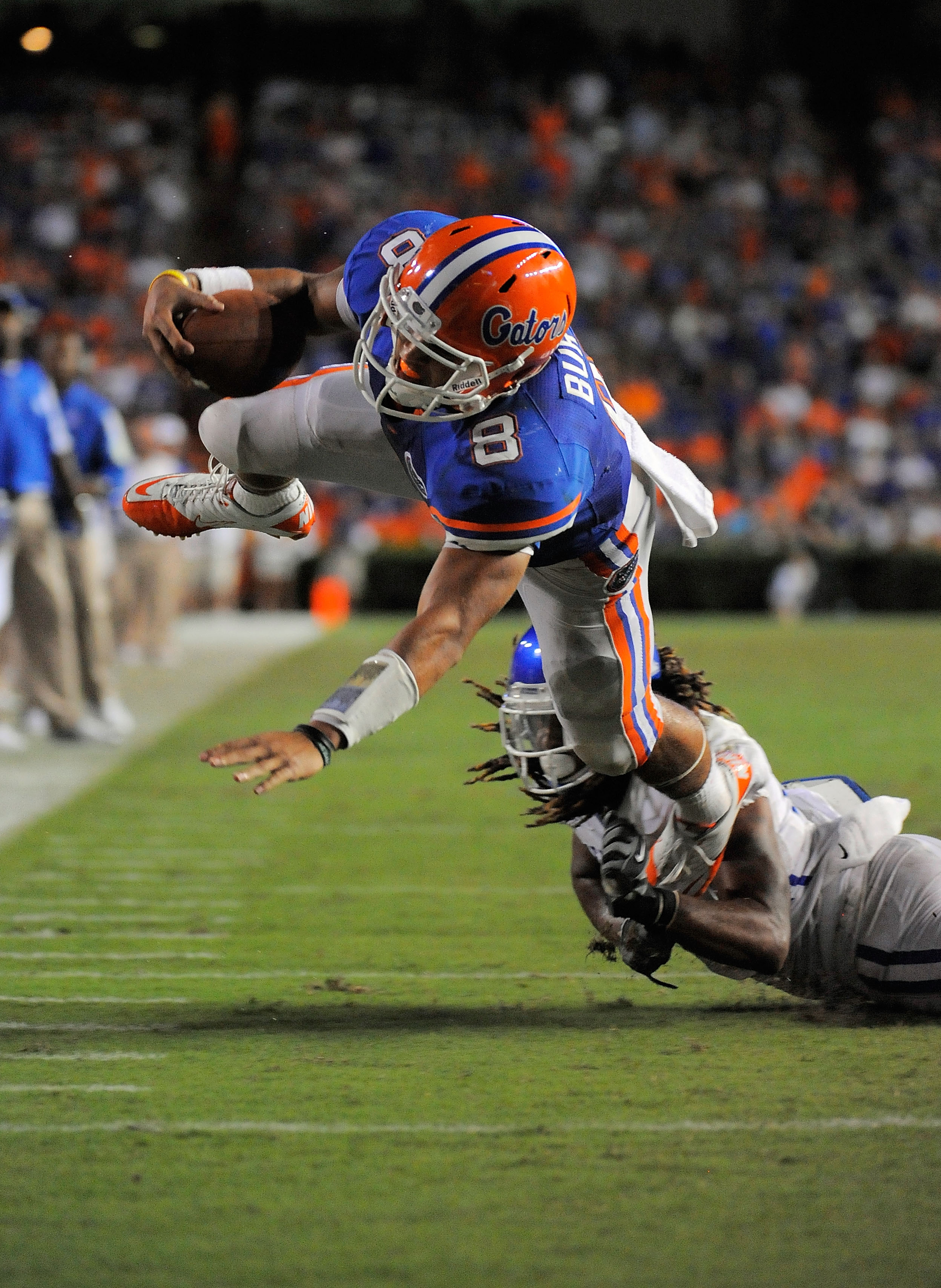 GAINESVILLE, FL - SEPTEMBER 25:  Quarterback Trey Burton #8 of the Florida Gators scores a touchdown as he is brought down by safety Winston Guy Jr. #21 of the Kentucky Wildcats at Ben Hill Griffin Stadium on September 25, 2010 in Gainesville, Florida. Fl