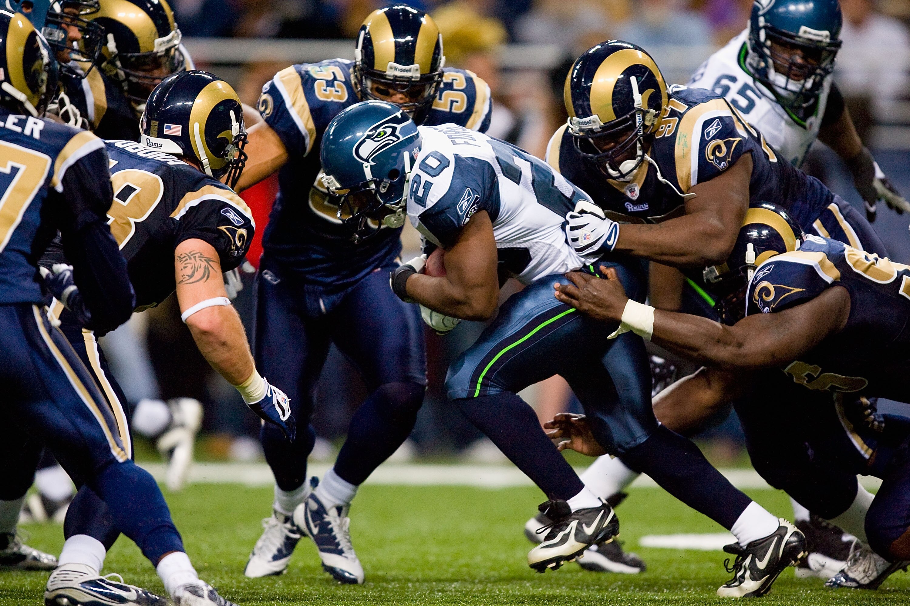 ST. LOUIS - NOVEMBER 29:  Justin Forsett #20 of the Seattle Seahawks rushes against the St. Louis Rams at the Edward Jones Dome on November 29, 2009 in St. Louis, Missouri.  The Seahawks beat the Rams 27-17.  (Photo by Dilip Vishwanat/Getty Images)