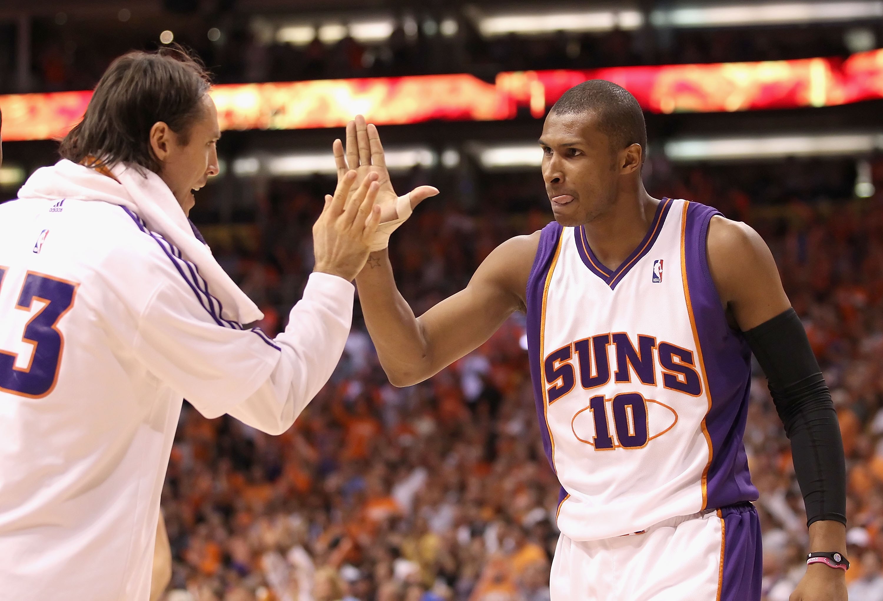 PHOENIX - MAY 25:  Leandro Barbosa #!0 of the Phoenix Suns celebrates with teammate Steve Nash #13 during Game Four of the Western Conference finals of the 2010 NBA Playoffs against the Los Angeles Lakers at US Airways Center on May 25, 2010 in Phoenix, A