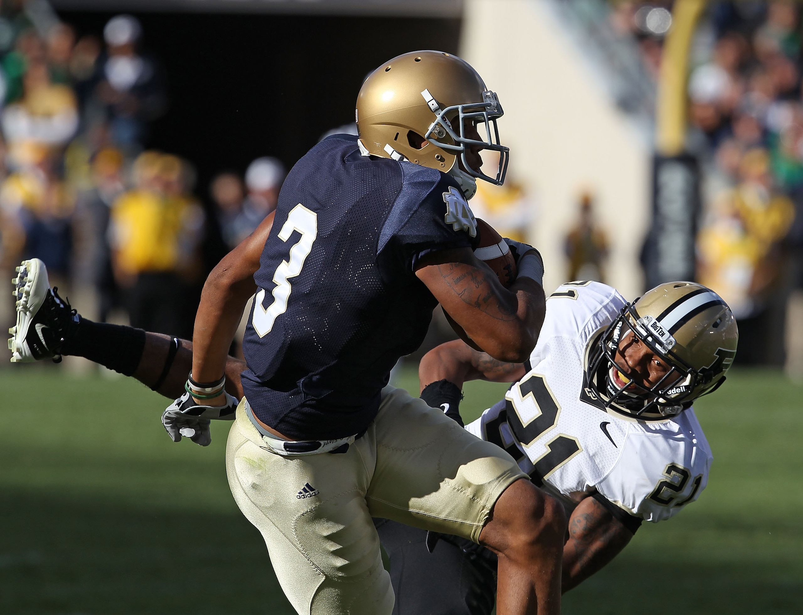 SOUTH BEND, IN - SEPTEMBER 04: Michael Floyd #3 of the Notre Dame Fighting Irish makes a catch under pressure from Ricardo Allen #21 of the Purdue Boilermakers at Notre Dame Stadium on September 4, 2010 in South Bend, Indiana. Notre Dame defeated Purdue 2