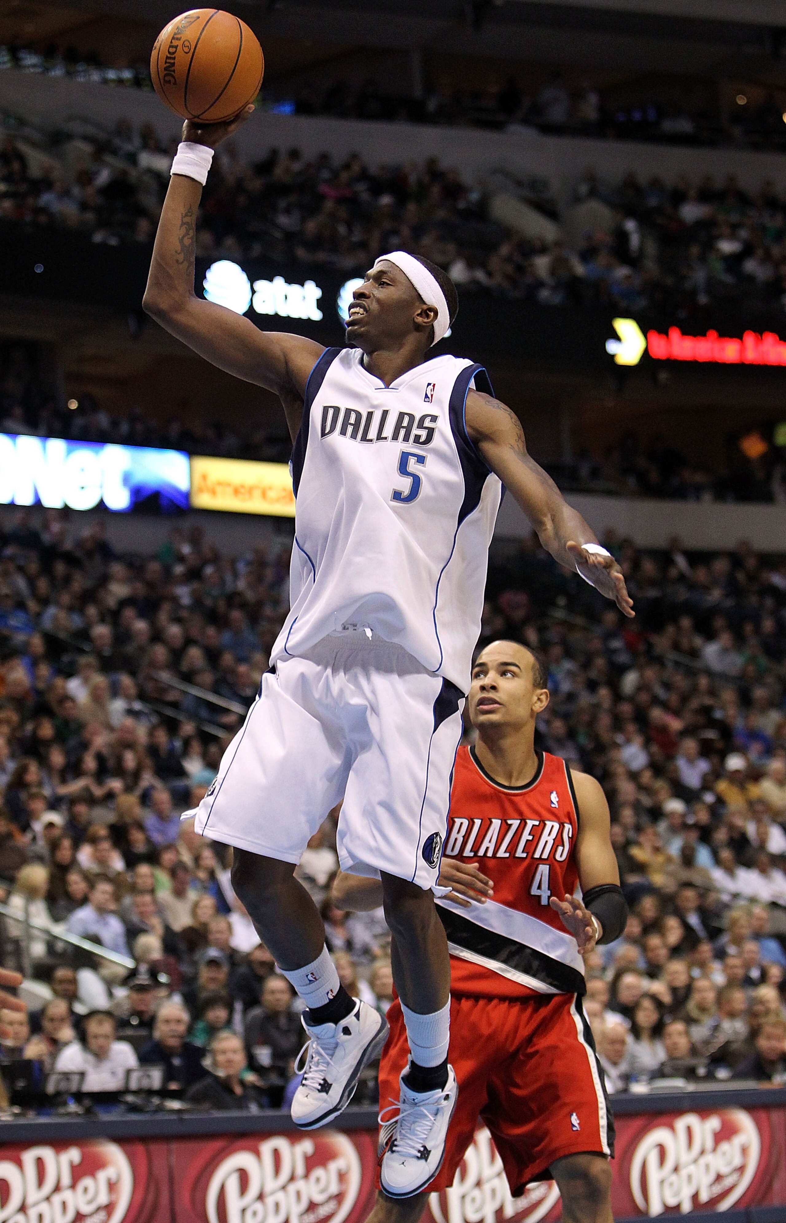 DALLAS - JANUARY 30:  Forward Josh Howard #5 of the Dallas Mavericks takes a shot against Jerryd Bayless #4 of the Portland Trail Blazers on January 30, 2010 at American Airlines Center in Dallas, Texas.  NOTE TO USER: User expressly acknowledges and agre
