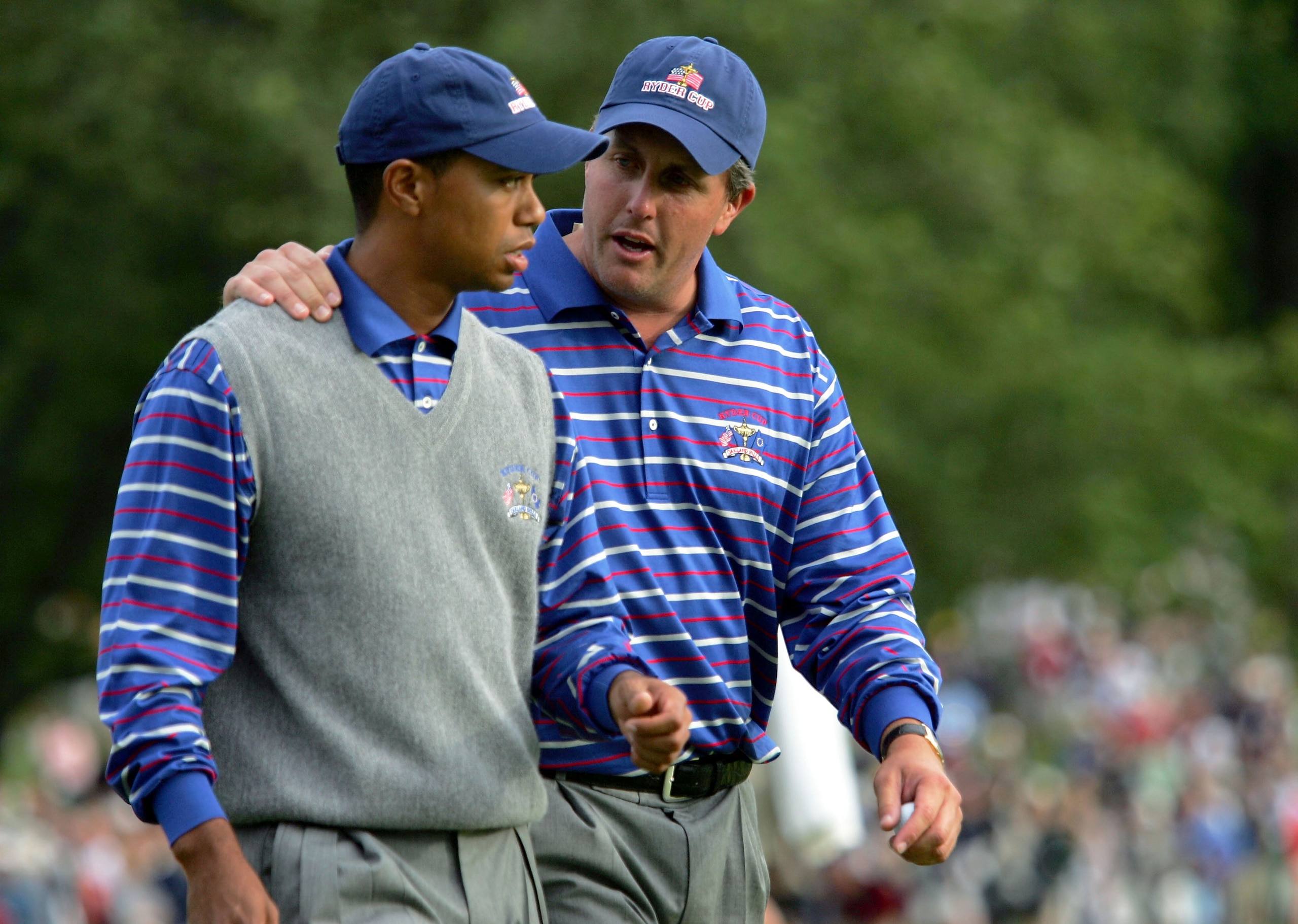 BLOOMFIELD TOWNSHIP, MI - SEPTEMBER 17: USA team players Tiger Woods and Phil Mickelson walk off the 18th green during their afternoon foursome match against Darren Clarke and Lee Westwood of Europe at the 35th Ryder Cup Matches at the Oakland Hills Count
