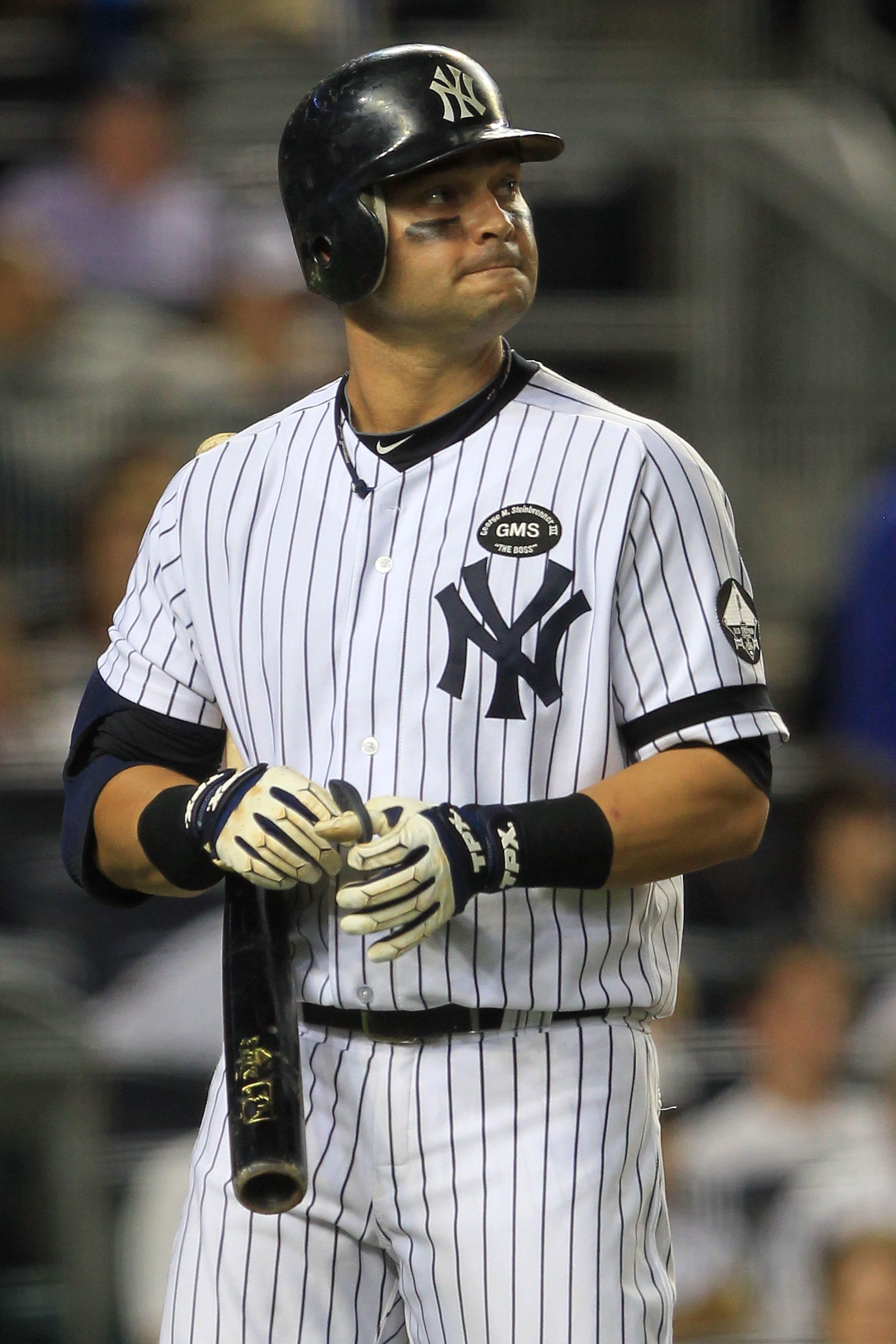 NEW YORK - SEPTEMBER 25: Nick Swisher #33 of the  New York Yankees reacts after striking out against  the Boston Red Sox during their game on September 25, 2010 at Yankee Stadium in the Bronx borough of New York City.  (Photo by Chris McGrath/Getty Images