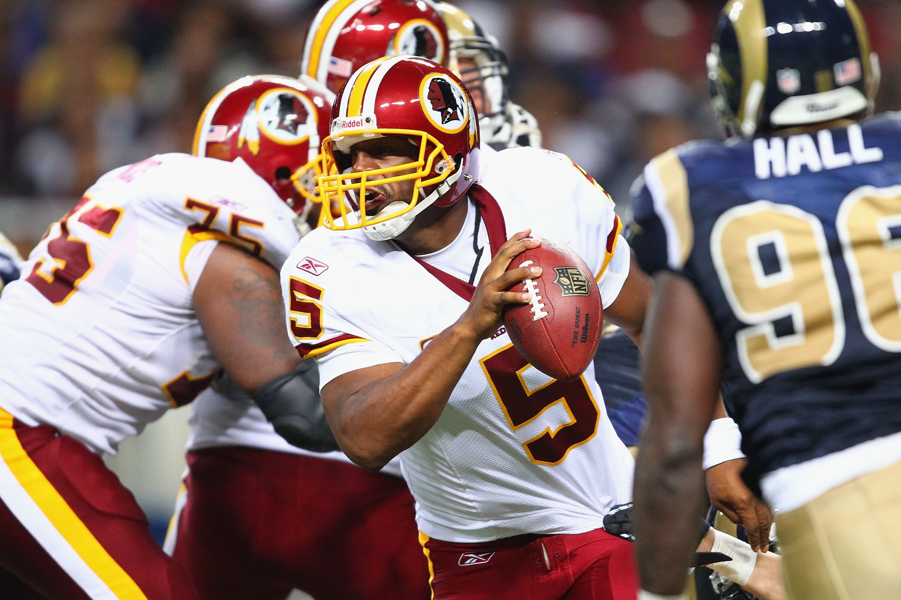 ST. LOUIS - SEPTEMBER 26: Donavan McNabb #5 of the Washington Redskins scrambles against the St. Louis Rams at the Edward Jones Dome on September 26, 2010 in St. Louis, Missouri.  The Rams beat the Redskins 30-16.  (Photo by Dilip Vishwanat/Getty Images)