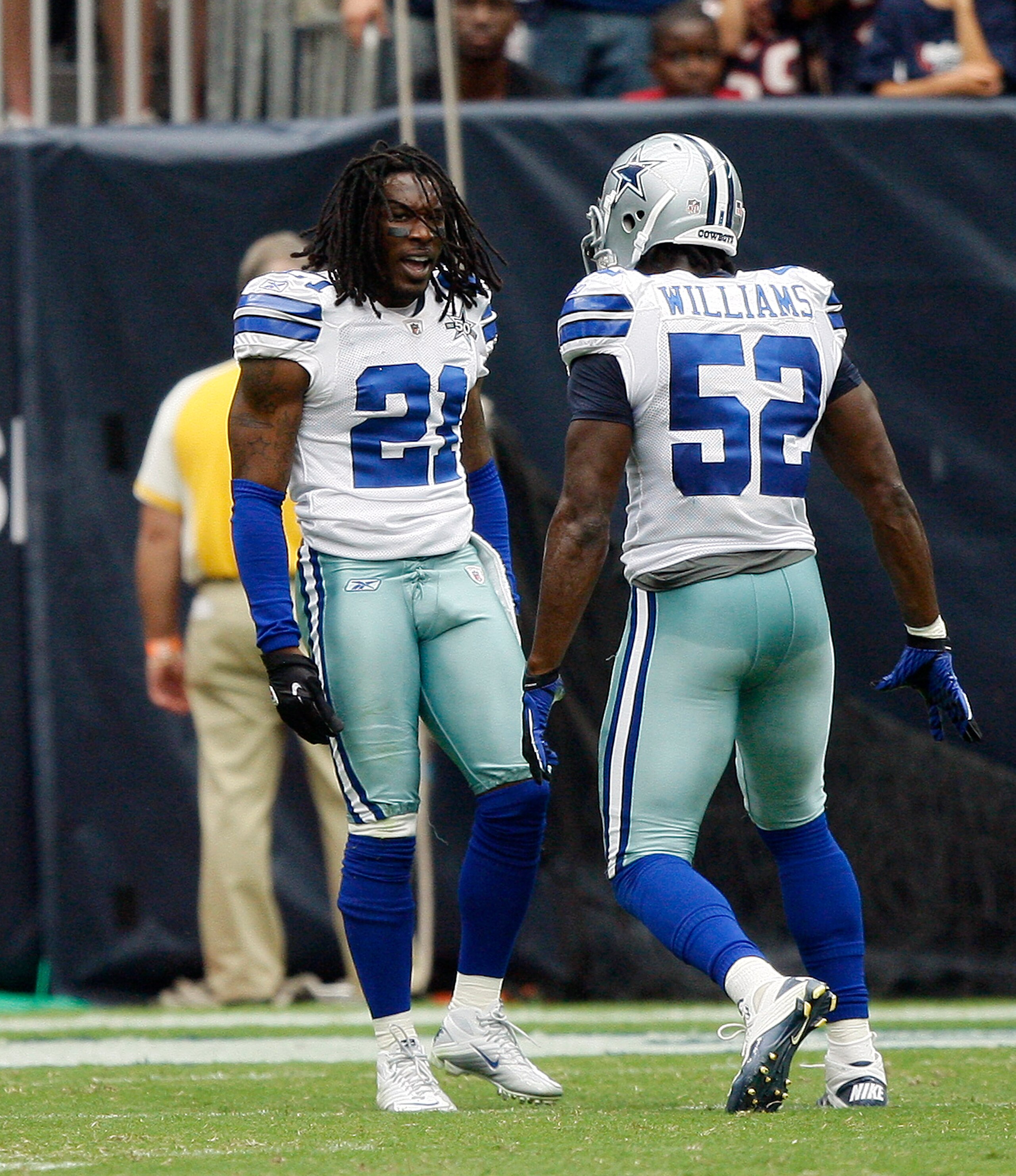 HOUSTON - SEPTEMBER 26:  Cornerback Mike Jenkins #21 of the Dallas Cowboys celebrates his interception against the Houston Texans in the third quarter with linebacker Leon Williams #52 at Reliant Stadium on September 26, 2010 in Houston, Texas.  (Photo by