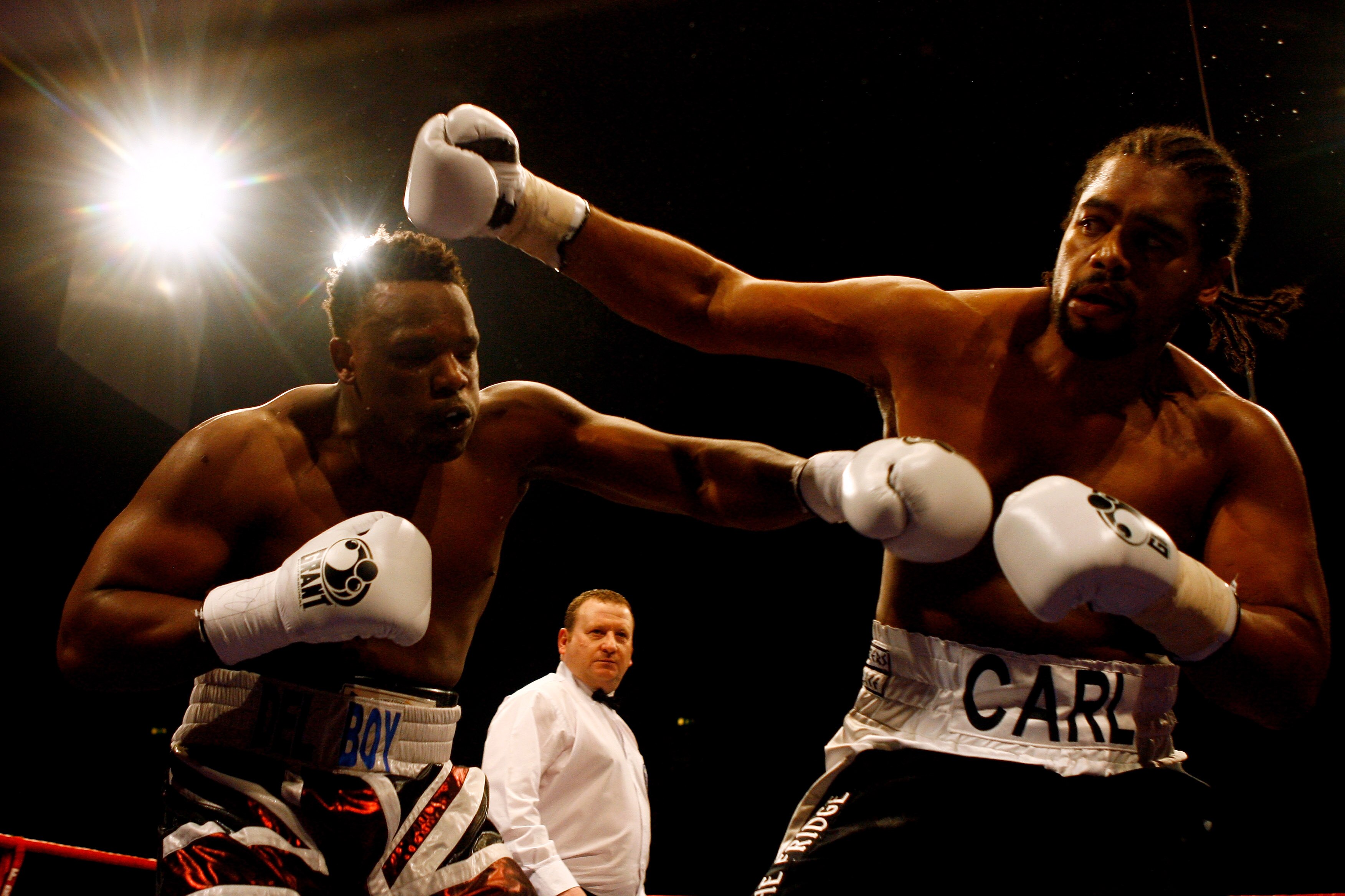 LONDON, ENGLAND - FEBRUARY 13:  Derek Chisora of Finchley (L) and Carl Baker of Shefield exchange blows in their Eliminator for British Heavyweight Title bout at Wembley Arena on February 13, 2010 in London, England.  (Photo by Dean Mouhtaropoulos/Getty I