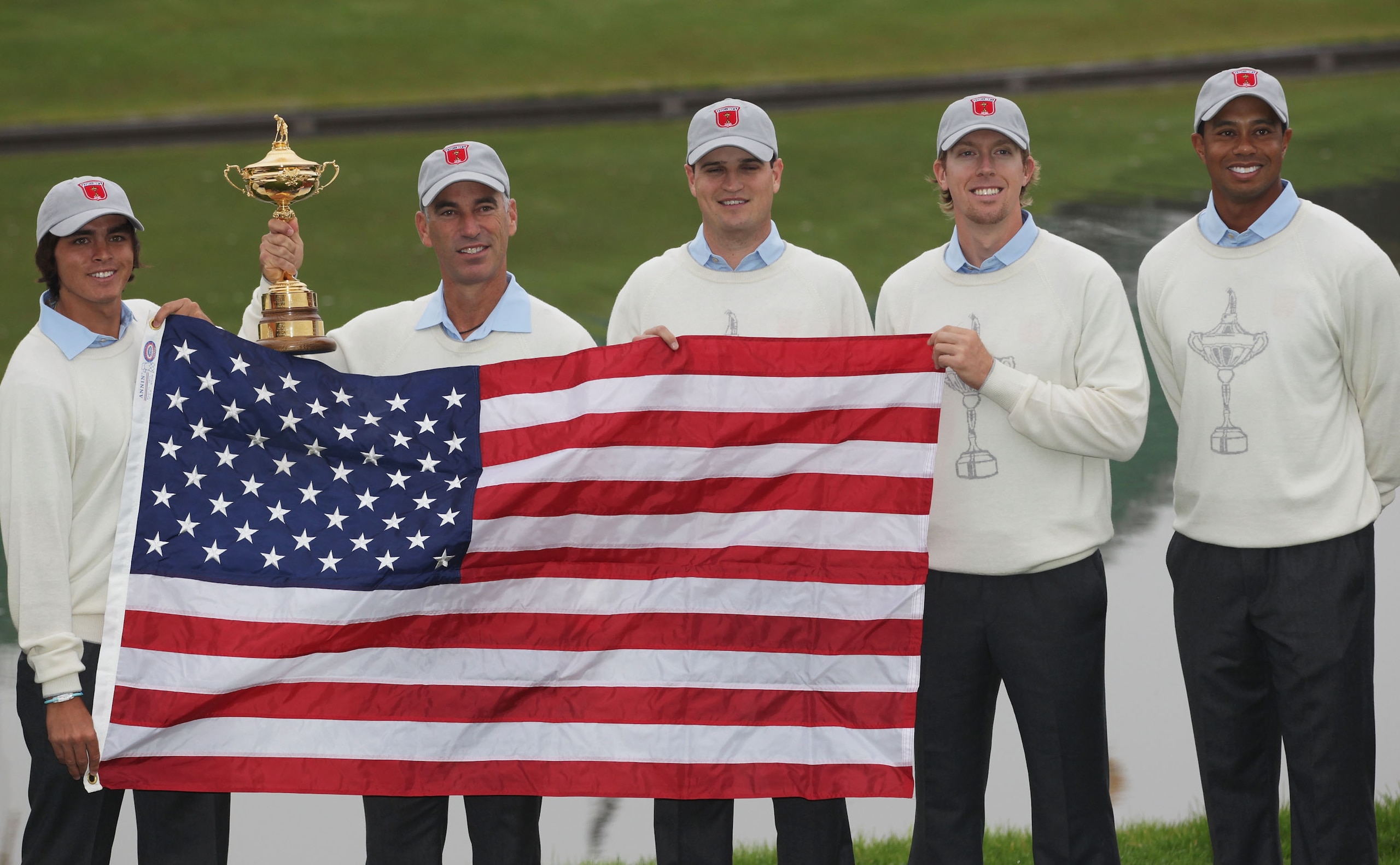 NEWPORT, WALES - SEPTEMBER 28:  (L-R) Rickie Fowler, Team Captain Corey Pavin, Zach Johnson, Hunter Mahan and Tiger Woods pose with the trophy and the American flag during the USA Team Photocall prior to the 2010 Ryder Cup at the Celtic Manor Resort on Se