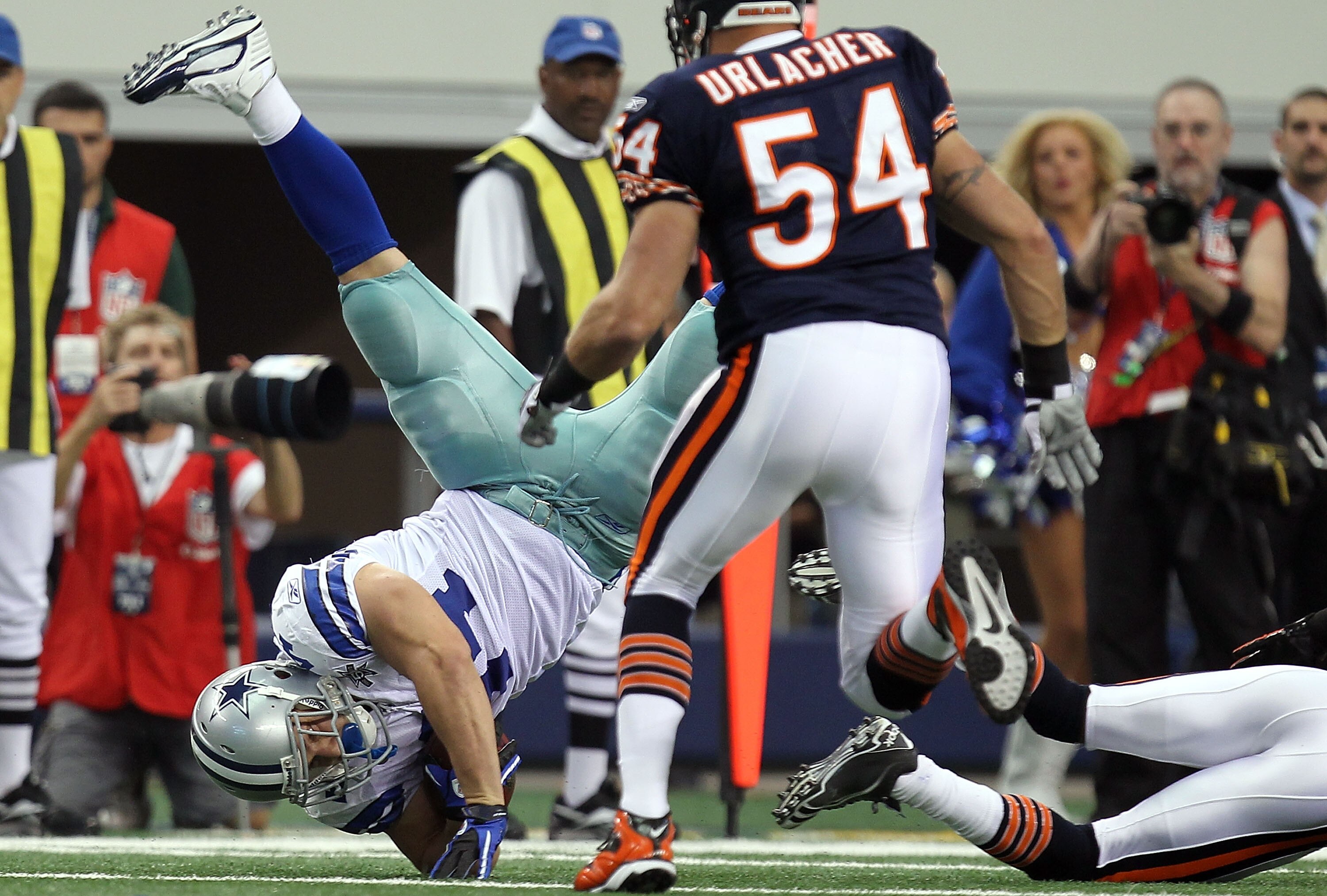 ARLINGTON, TX - SEPTEMBER 19:  Fullback Chris Gronkowski #44 of the Dallas Cowboys flips after a tackle by Zackary Bowman #35 of the Chicago Bears at Cowboys Stadium on September 19, 2010 in Arlington, Texas.  (Photo by Ronald Martinez/Getty Images)