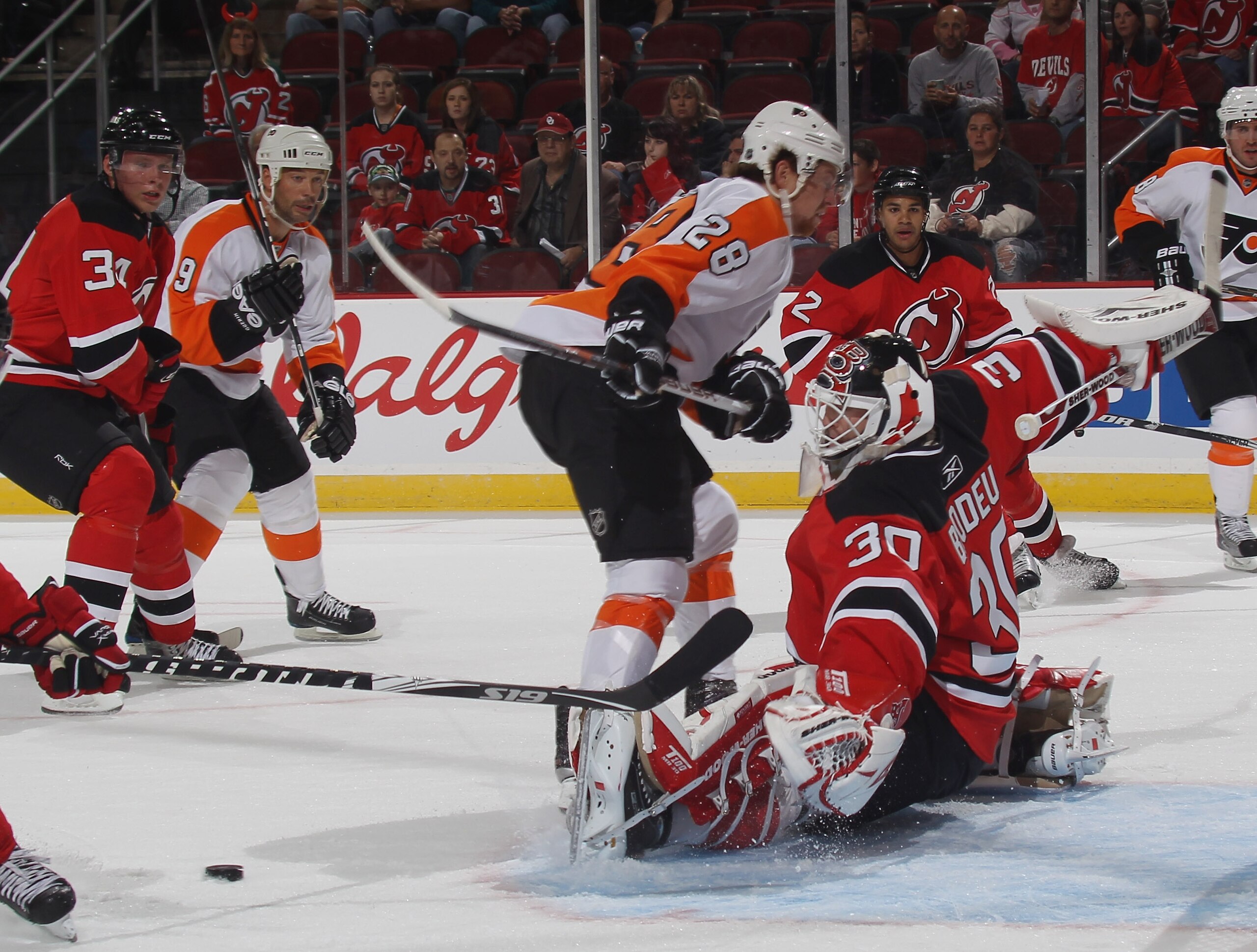 NEWARK, NJ - SEPTEMBER 28: Claude Giroux #28 of the Philadelphia Flyers is stopped by Martin Brodeur #30 of the New Jersey Devils at the Prudential Center on September 28, 2010 in Newark, New Jersey. (Photo by Bruce Bennett/Getty Images)